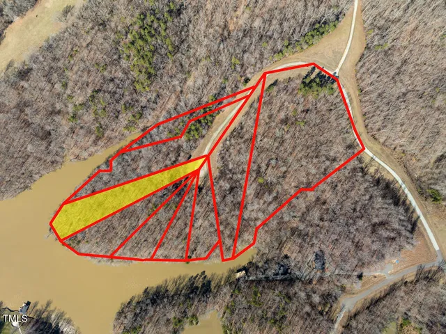 a white vase with lots of flowers