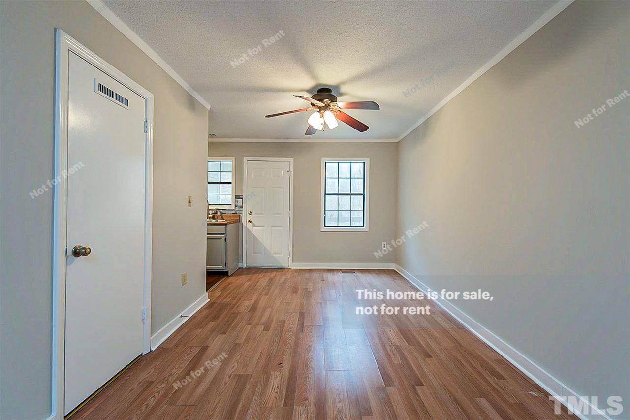 3622 Colchester Street, Unit 26 Durham, NC 27707 - Photo 11 of 16 a view of empty room with wooden floor and fan