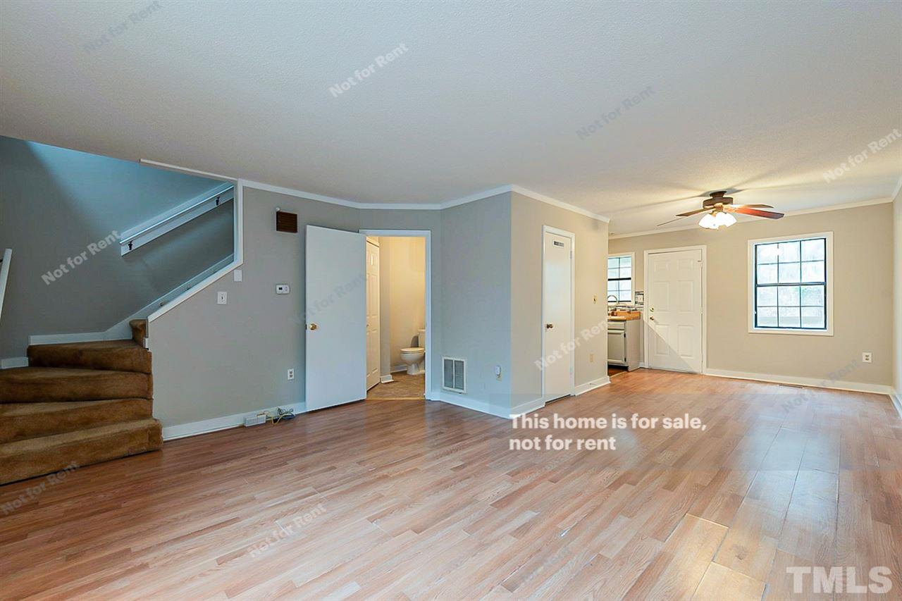 3622 Colchester Street, Unit 26 Durham, NC 27707 - Photo 5 of 16 a view of an empty room with wooden floor and a window