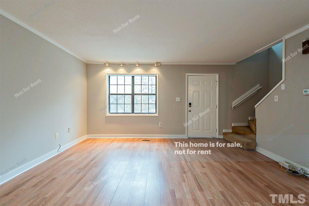 3622 Colchester Street, Unit 26 Durham, NC 27707 - Photo 10 of 16 wooden floor in an empty room with a window