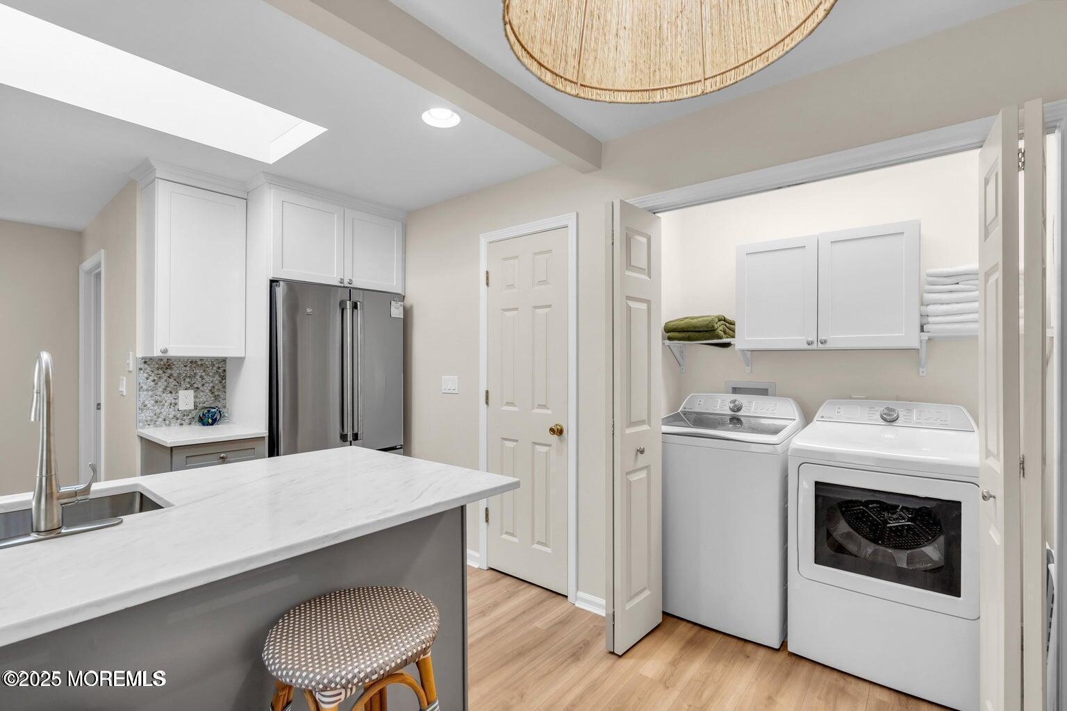 520 Brighton Avenue Spring Lake, NJ 07762 - Photo 12 of 25 a kitchen with refrigerator and cabinets