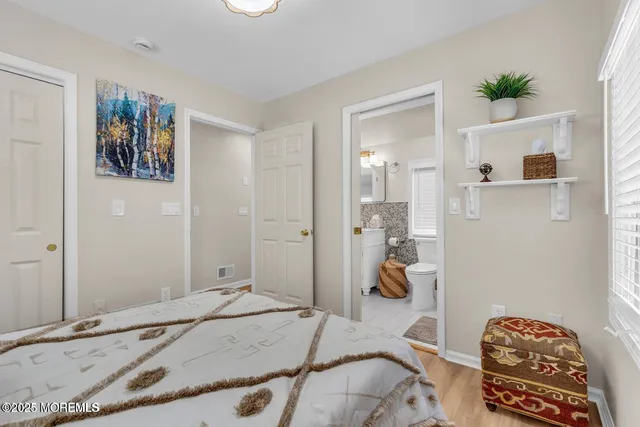 a bedroom with a bed and utility room