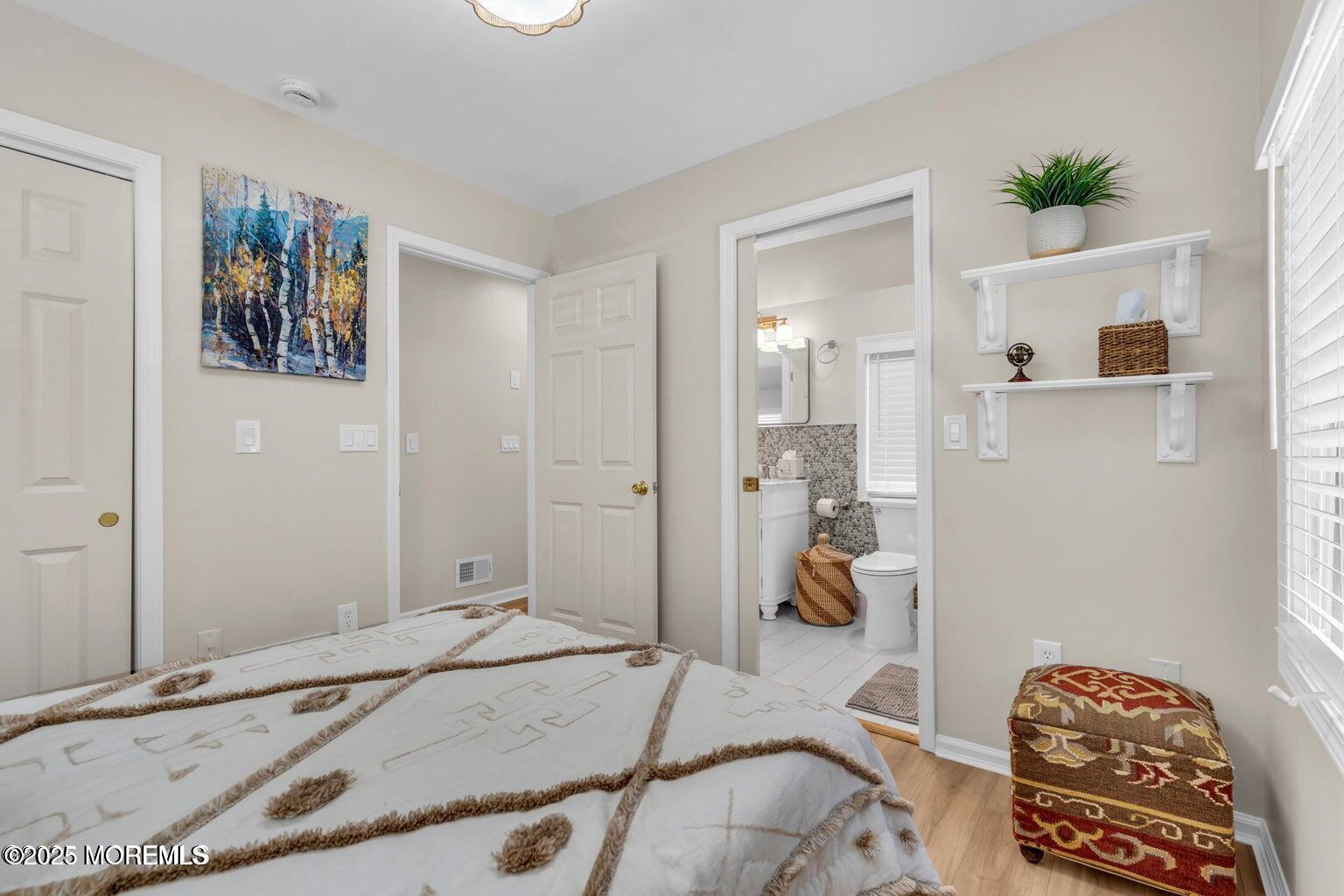 520 Brighton Avenue Spring Lake, NJ 07762 - Photo 18 of 25 a bedroom with a bed and utility room