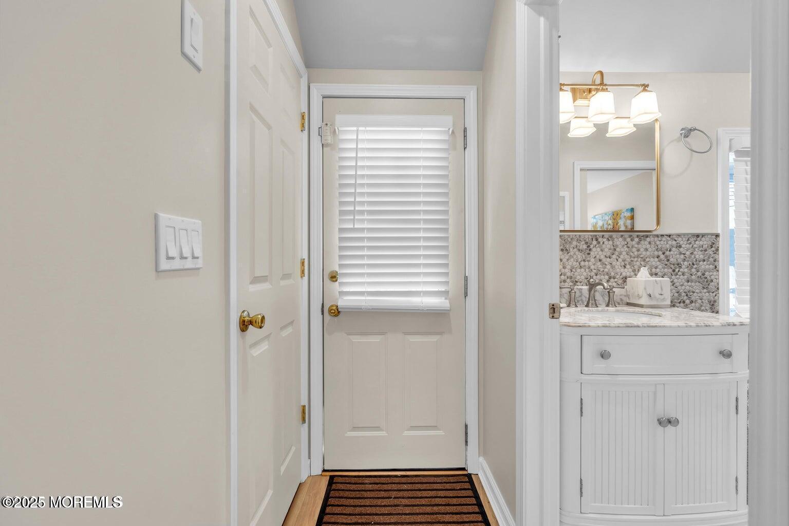 520 Brighton Avenue Spring Lake, NJ 07762 - Photo 19 of 25 a bathroom with a sink and a mirror