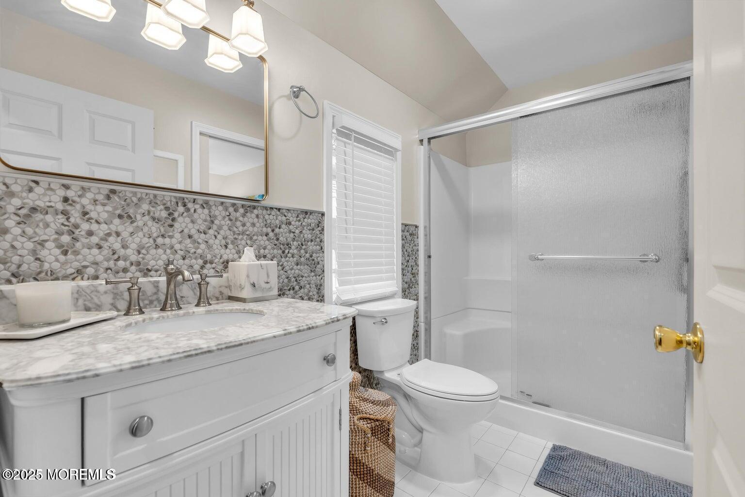 520 Brighton Avenue Spring Lake, NJ 07762 - Photo 20 of 25 a bathroom with a granite countertop sink toilet and shower