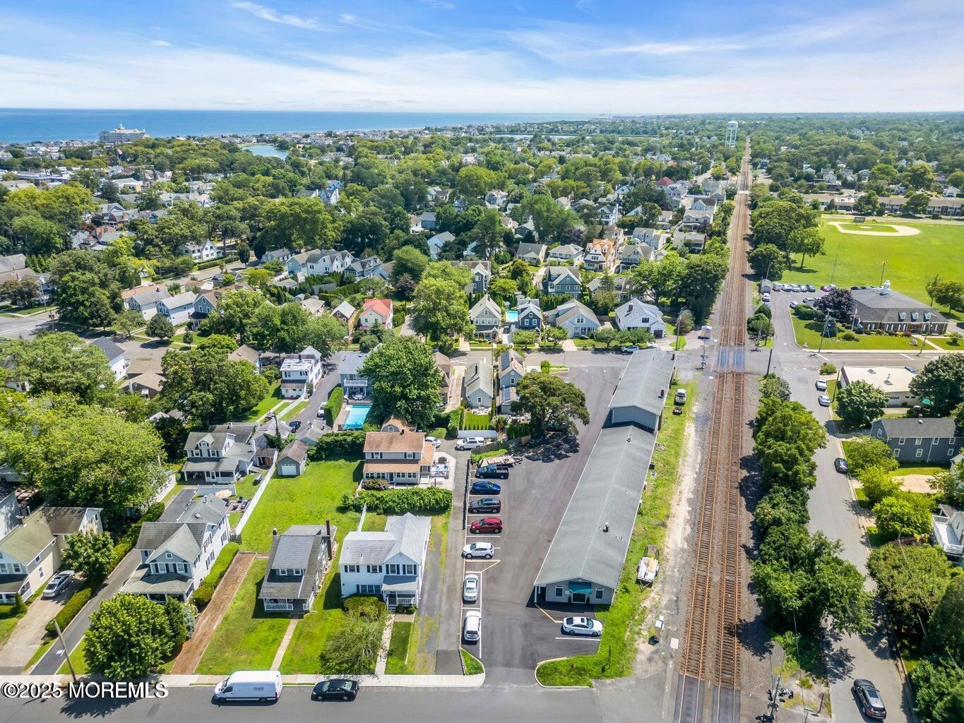 520 Brighton Avenue Spring Lake, NJ 07762 - Photo 25 of 25 an aerial view of a city with lots of residential buildings ocean and mountain view in back