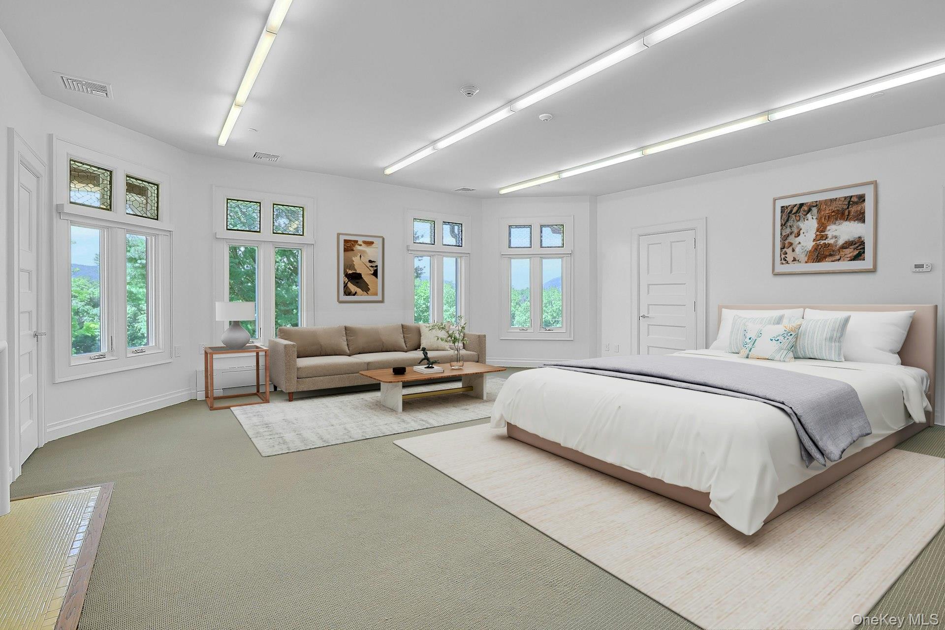 20 Nazareth Way Cold Spring, NY 10516 - Photo 25 of 50 To the left of the sitting room is the possible first bedroom on this floor. Virtually staged, this expansive, bright room has ample space for a bed, seating area and entertainment nook. There is a closet on the left.