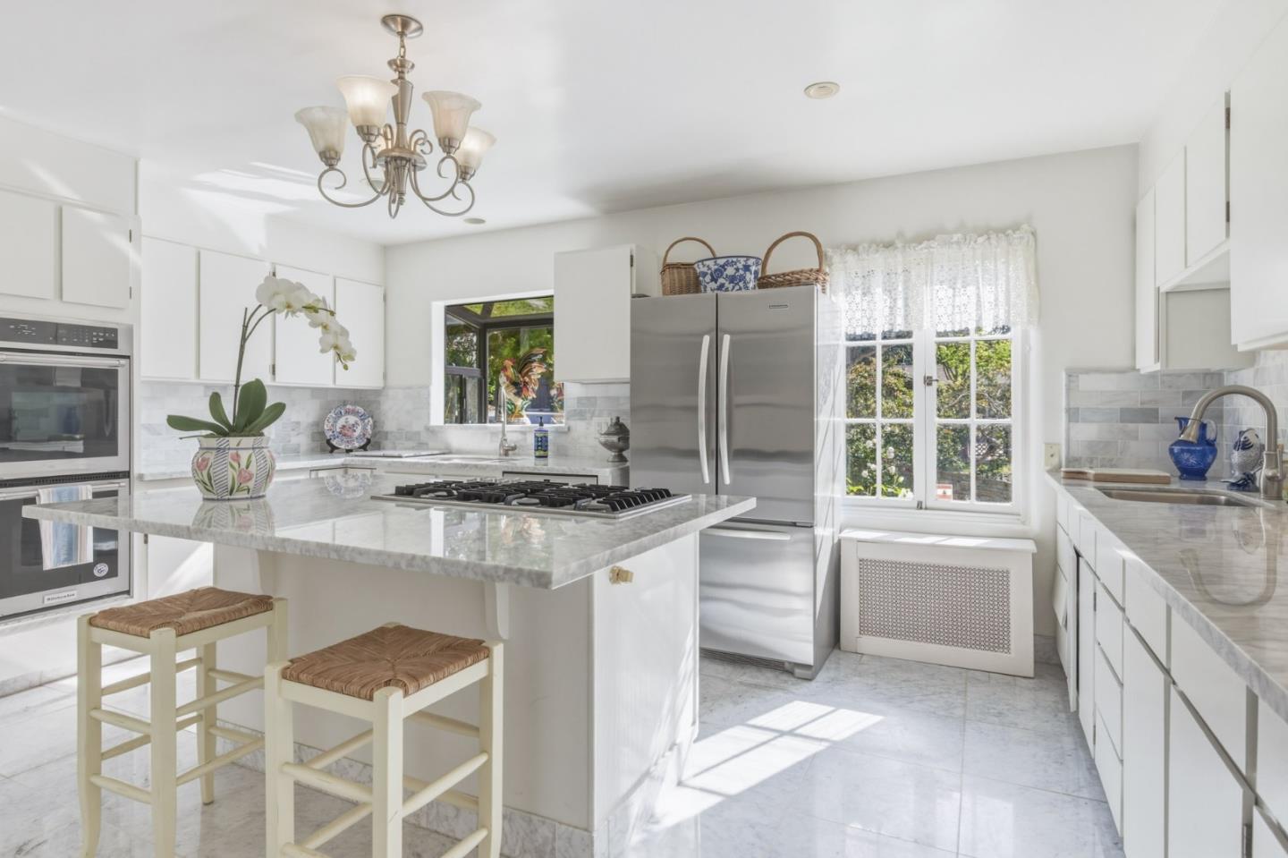 25286 Hatton Road Carmel, CA 93923 - Photo 14 of 34 a kitchen with granite countertop a sink and cabinets