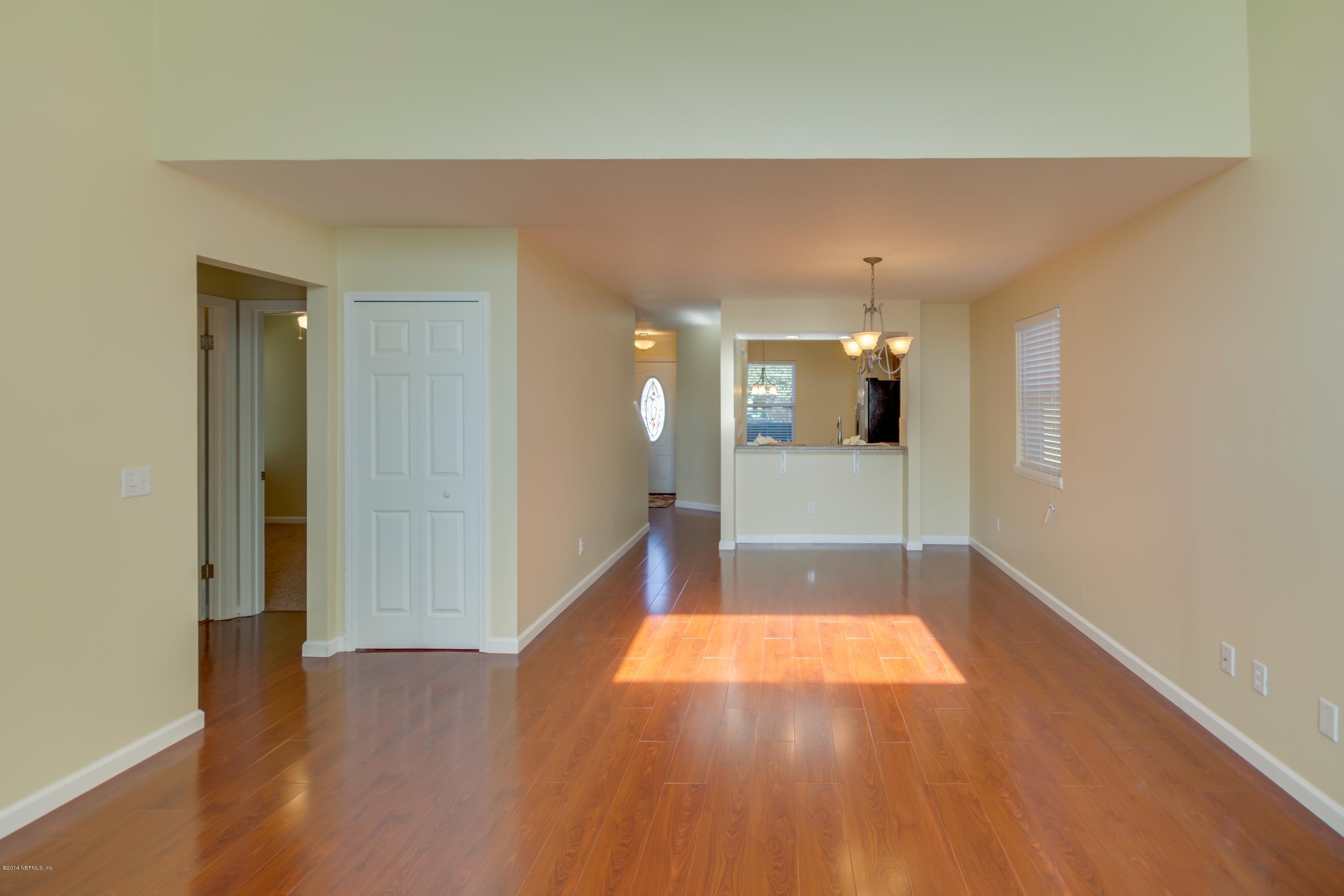 11788 Wattle Tree Road West Jacksonville, FL 32246 - Photo 7 of 23 a view of a hallway with wooden floor