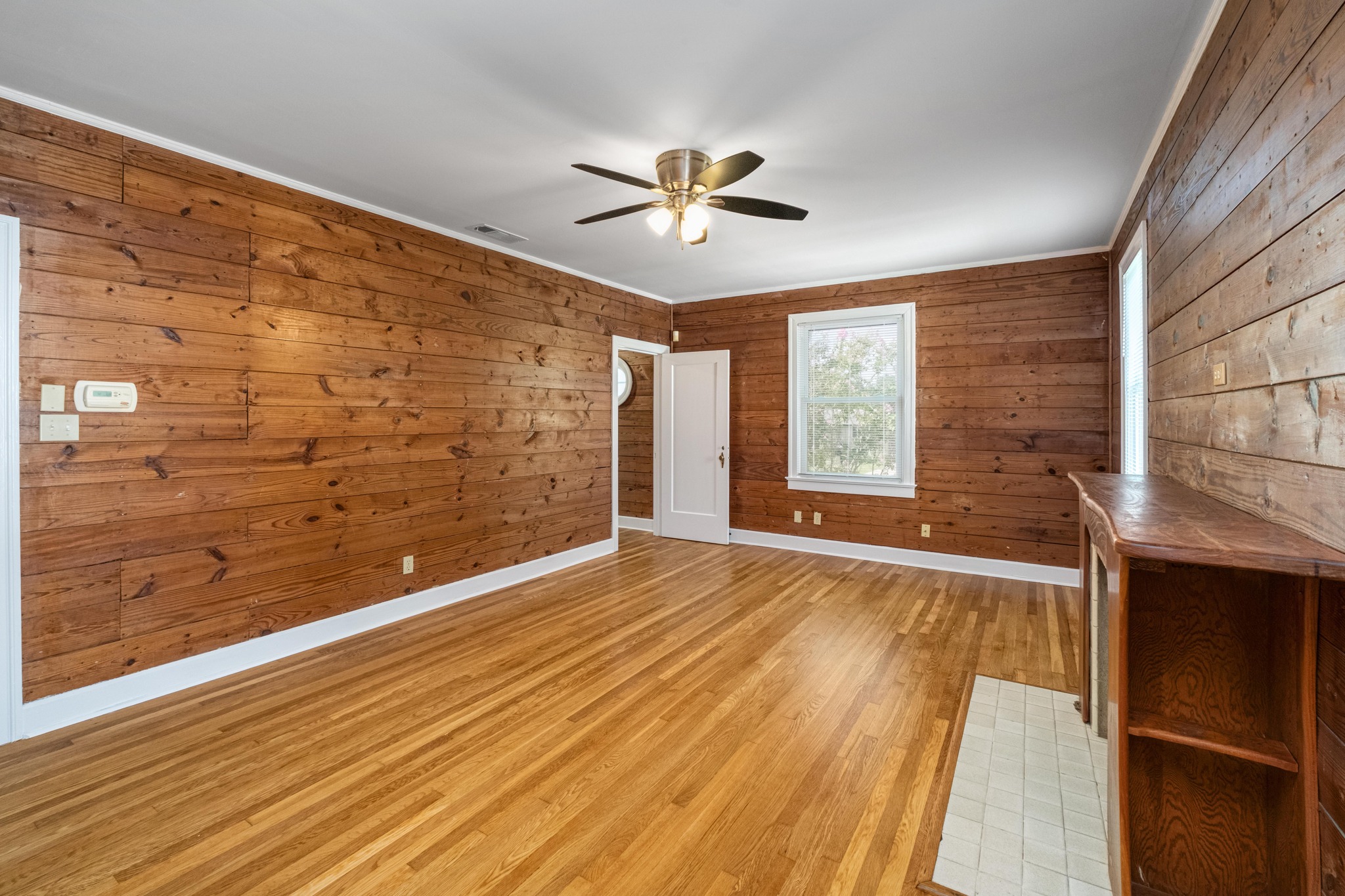 2012 Enfield Road, Unit B Austin, TX 78703 - Photo 5 of 20 Warm wood paneling and gleaming hardwood floors create an inviting atmosphere.