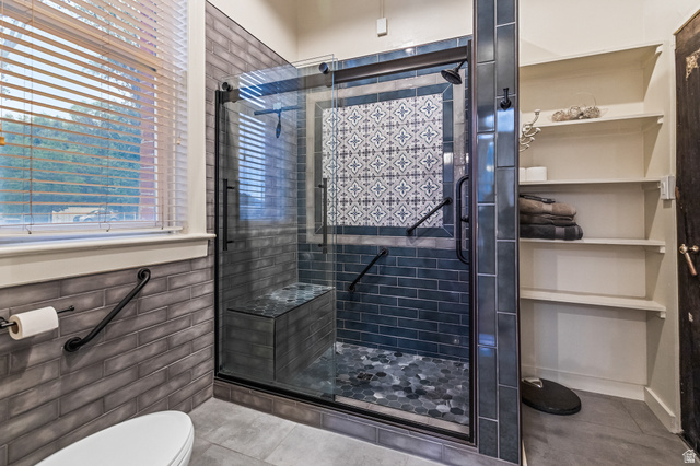 21 North Main Street Kingston, UT 84743 - Photo 81 of 107 Bathroom featuring a shower stall, tile patterned flooring, and tile walls