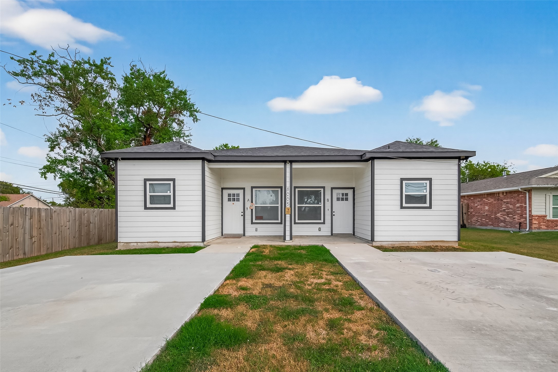 8005 Sexton Street, Unit B Houston, TX 77028 - Photo 2 of 43 a view of a house with a yard and potted plants