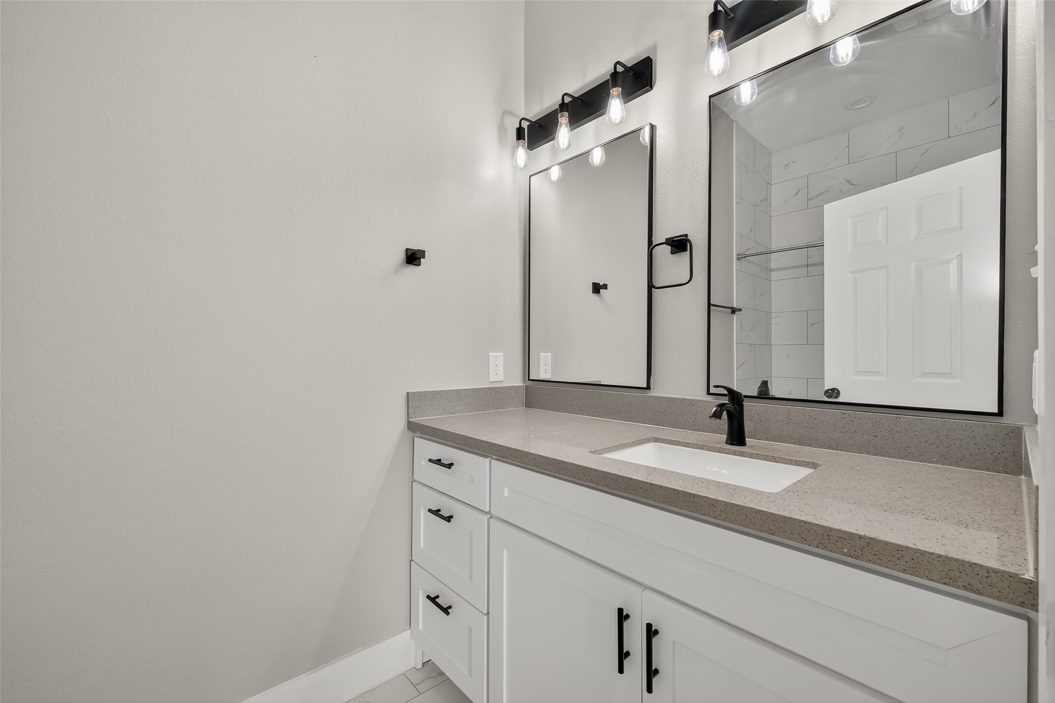 8005 Sexton Street, Unit B Houston, TX 77028 - Photo 23 of 43 a bathroom with a granite countertop sink and mirror