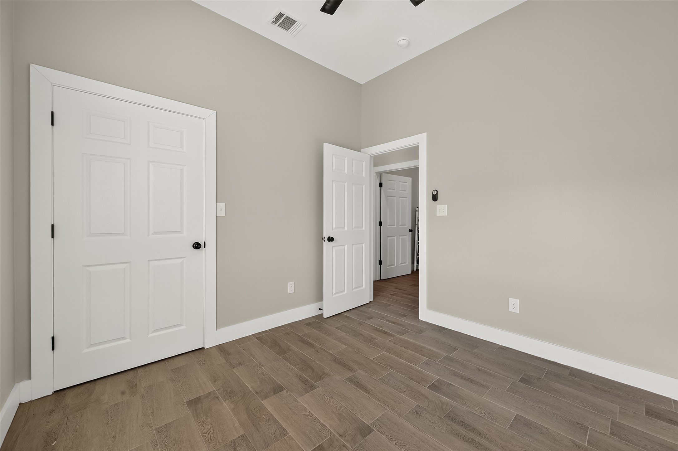 8005 Sexton Street, Unit B Houston, TX 77028 - Photo 27 of 43 a view of an empty room with wooden floor