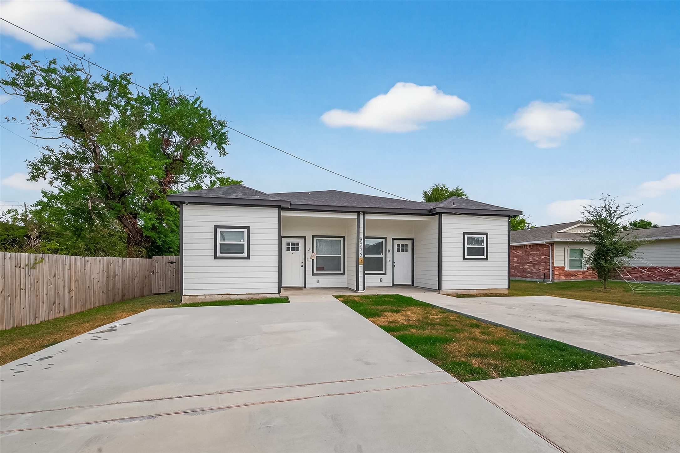 8005 Sexton Street, Unit B Houston, TX 77028 - Photo 3 of 43 a view of a house with a yard and plants