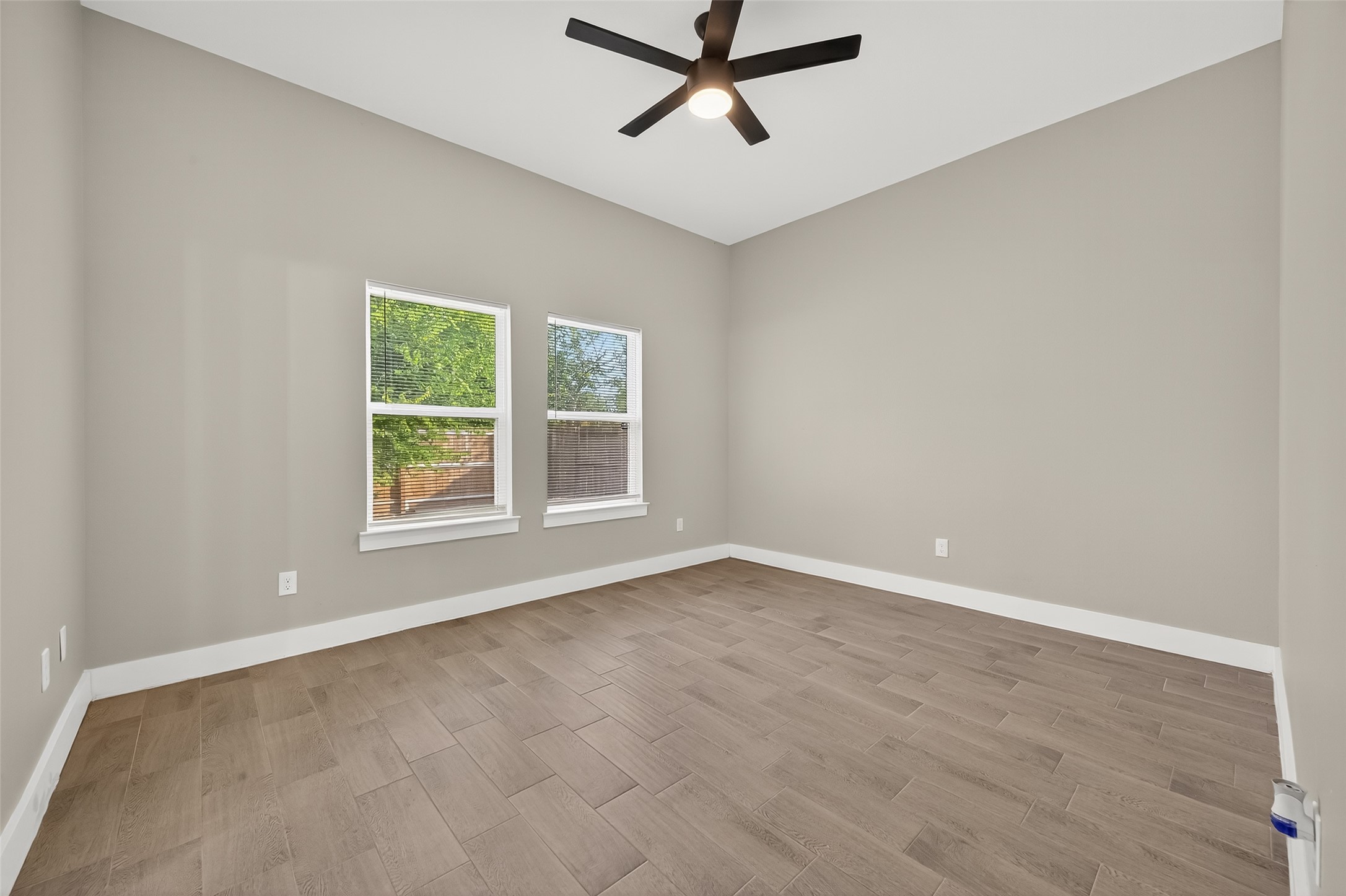 8005 Sexton Street, Unit B Houston, TX 77028 - Photo 31 of 43 wooden floor in an empty room with a window