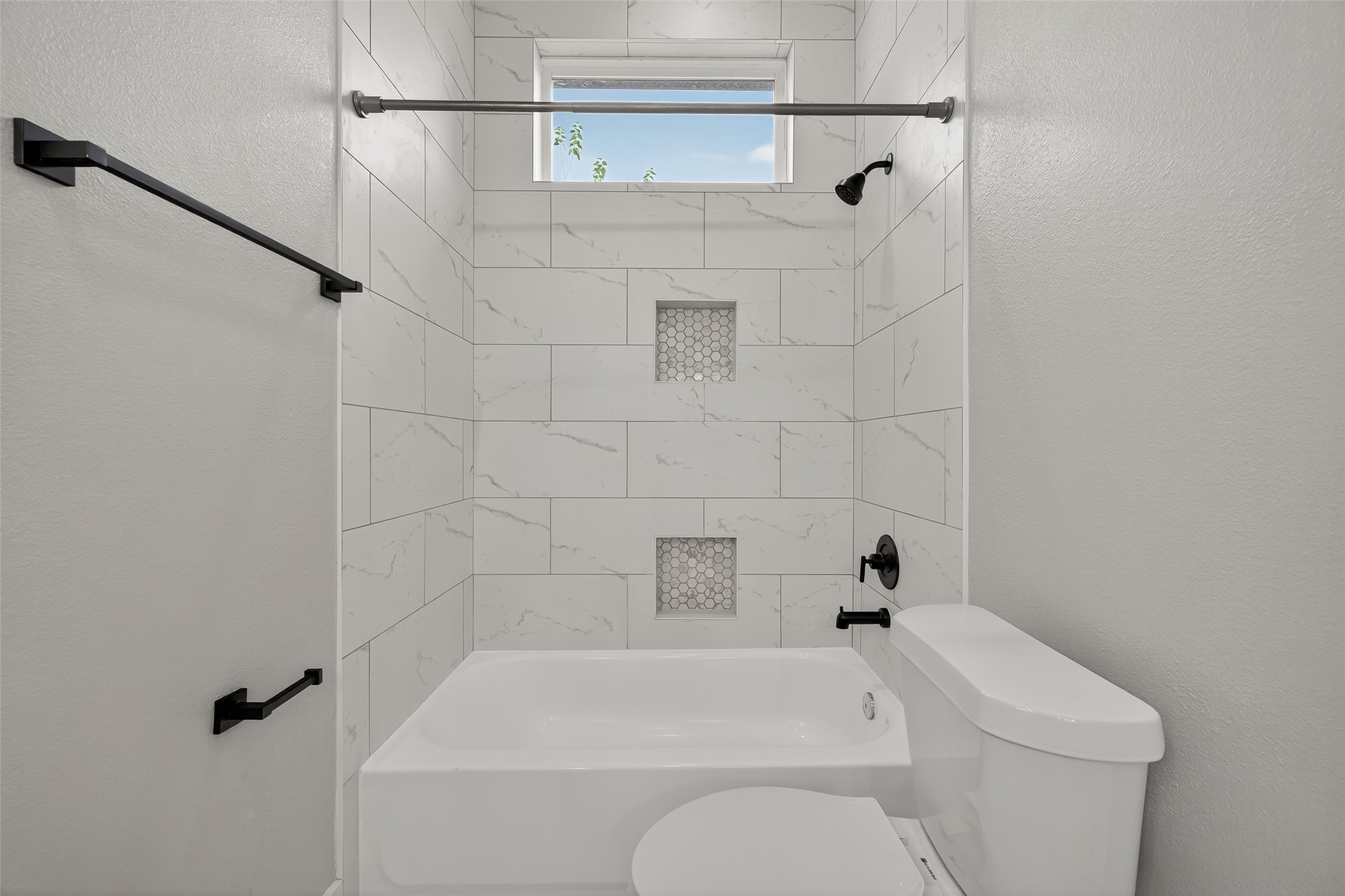 8005 Sexton Street, Unit B Houston, TX 77028 - Photo 36 of 43 a bathroom with a toilet and a shower