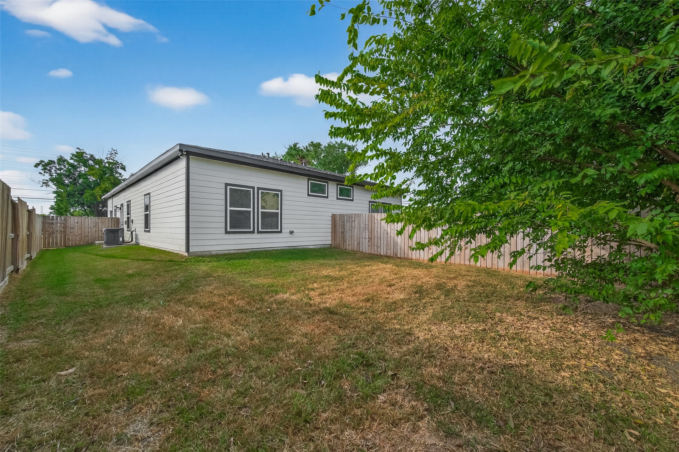 8005 Sexton Street, Unit B Houston, TX 77028 - Photo 40 of 43 a view of a house with backyard and garden
