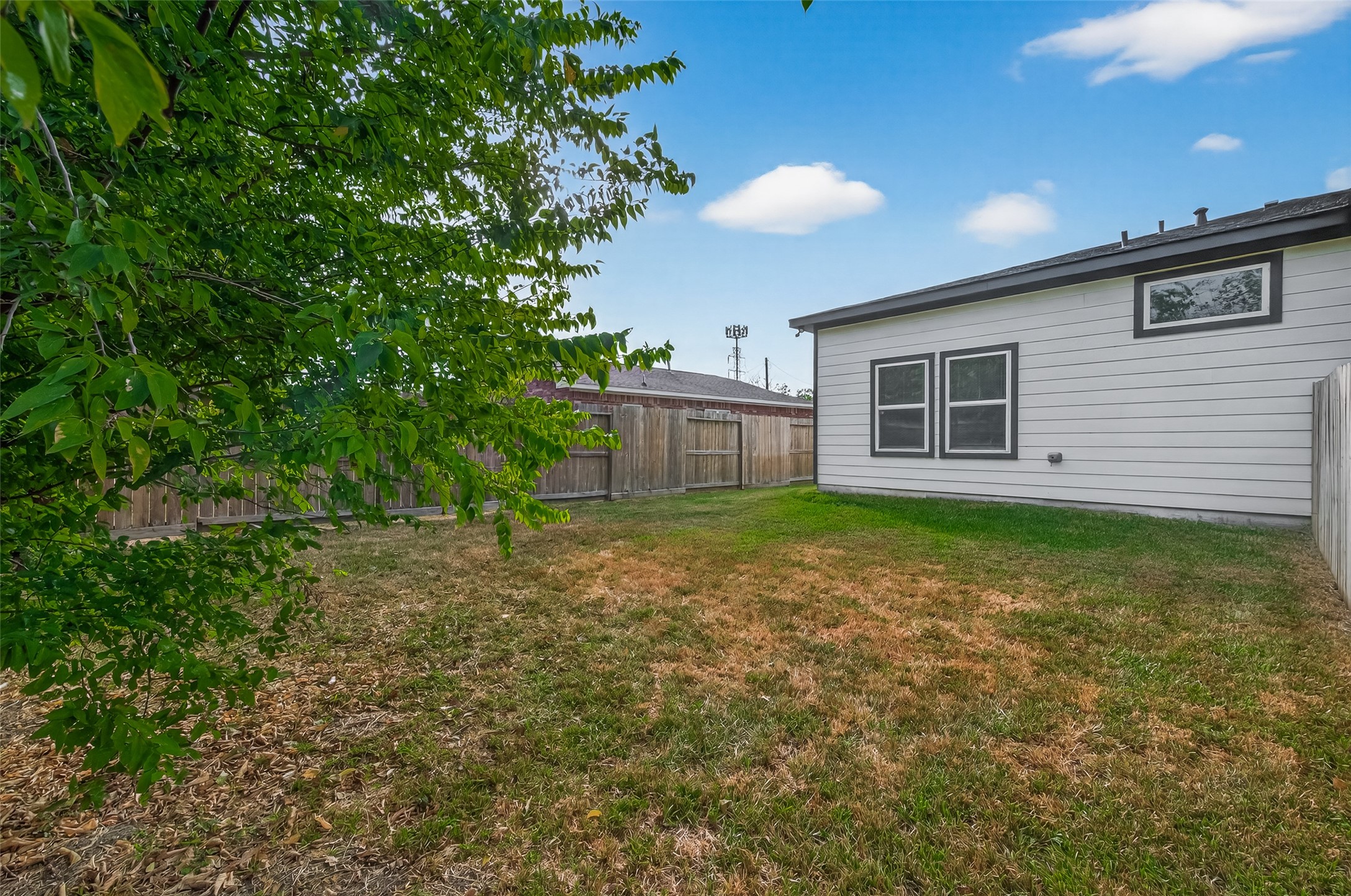 8005 Sexton Street, Unit B Houston, TX 77028 - Photo 41 of 43 a view of a house with a yard