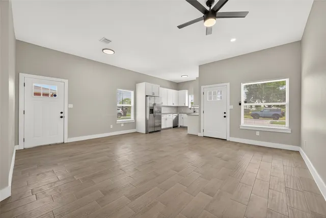 a view of livingroom with hardwood floor and ceiling fan