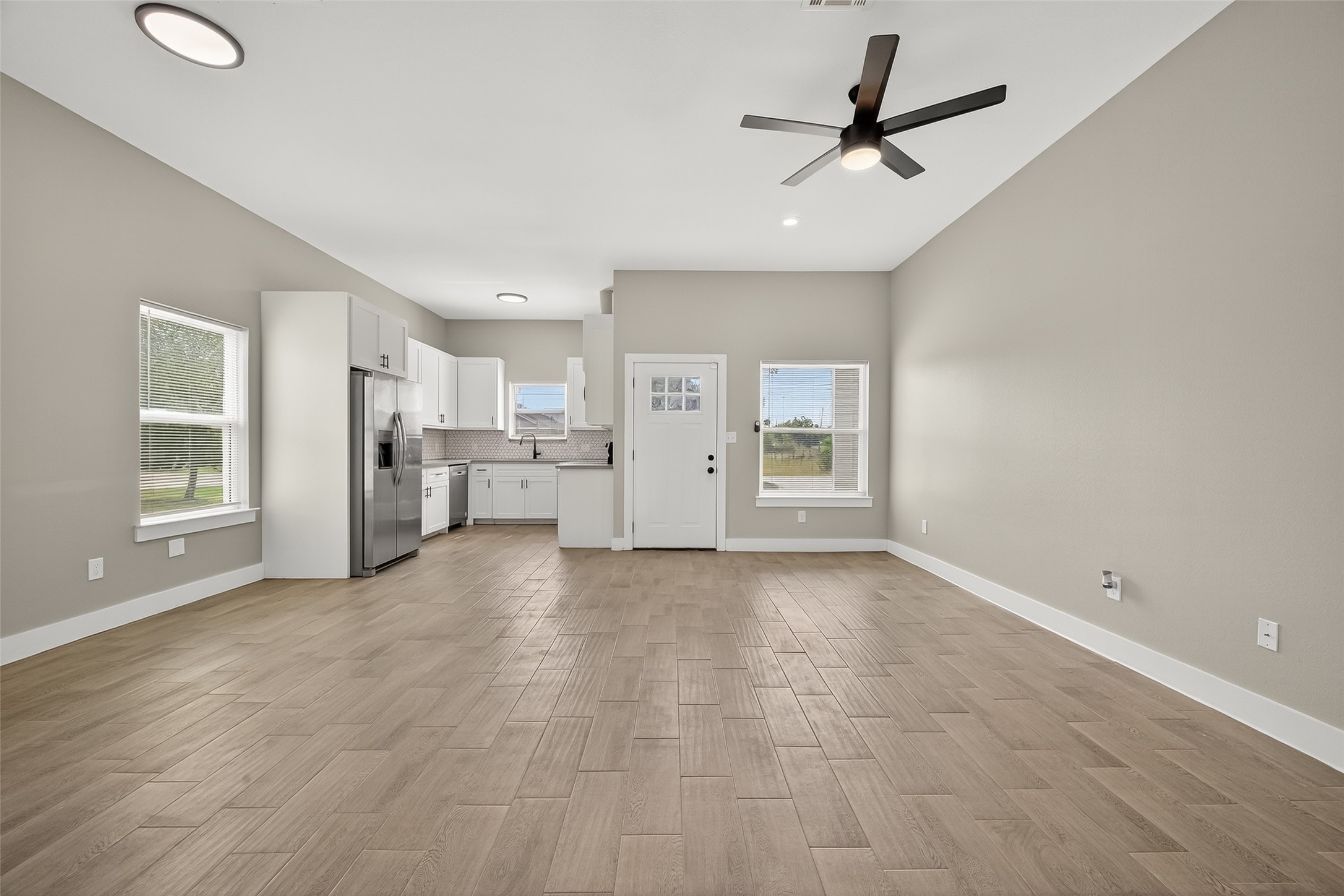 8005 Sexton Street, Unit B Houston, TX 77028 - Photo 9 of 43 a view of a kitchen with a sink and a refrigerator