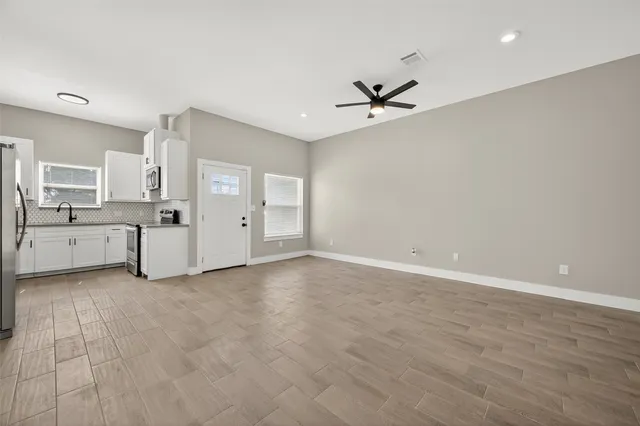 a view of a kitchen with electric appliances