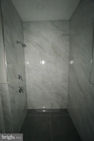 a bathroom with a toilet a sink a vanity and mirror