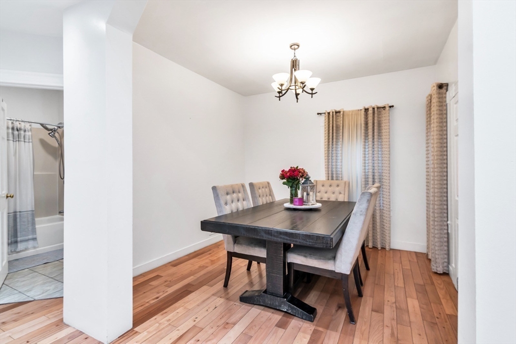 42 D Street Lowell, MA 01851 - Photo 16 of 27 a view of a dining room with furniture and wooden floor