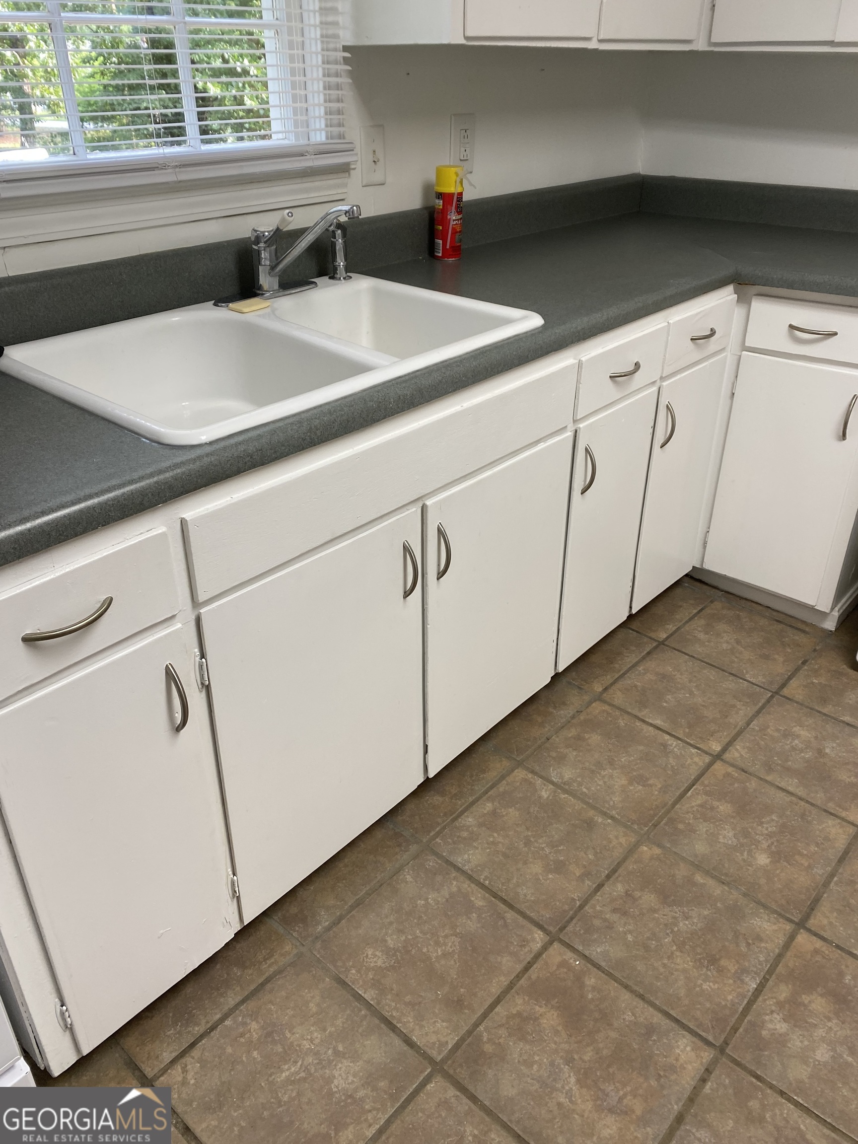 164 Glenn Carrie Road Hull, GA 30646 - Photo 15 of 43 a kitchen with a sink cabinets and window