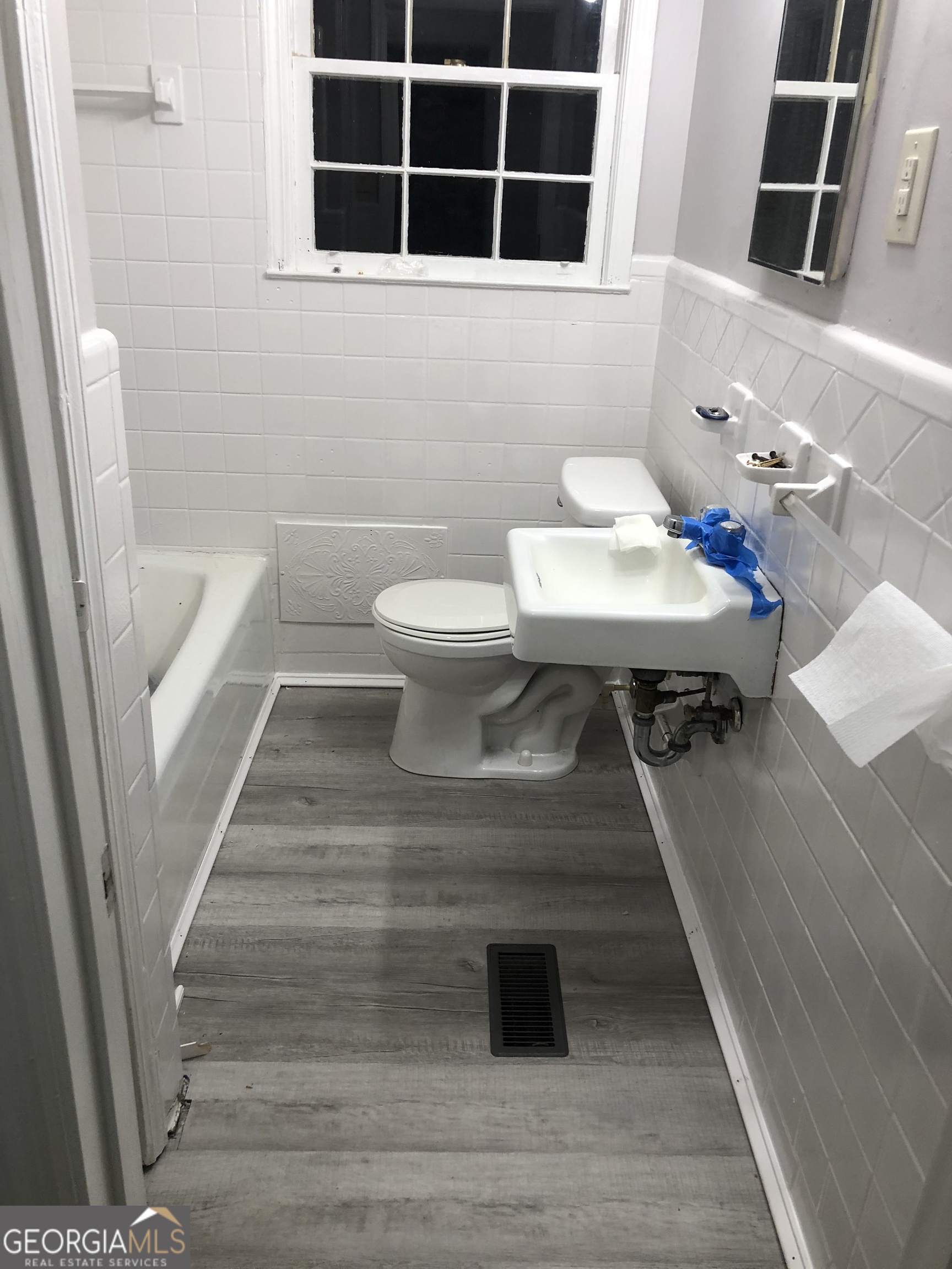 164 Glenn Carrie Road Hull, GA 30646 - Photo 28 of 43 a bathroom with a sink and a mirror
