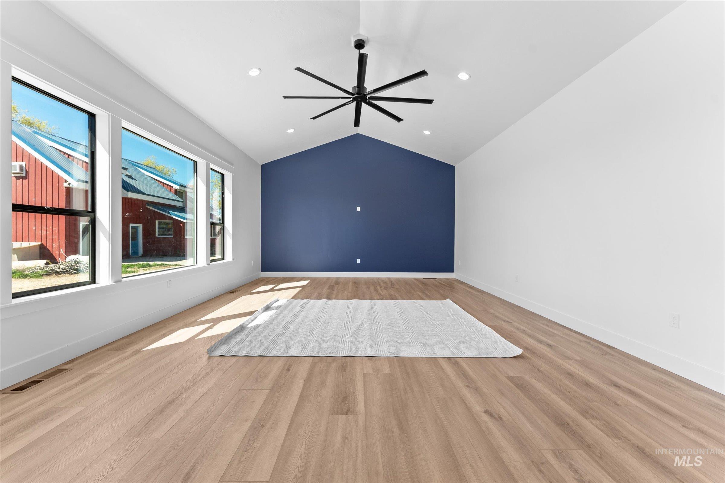26219 Reed Lane Wilder, ID 83676 - Photo 12 of 35 Empty room with a ceiling fan, light wood-style flooring, and recessed lighting