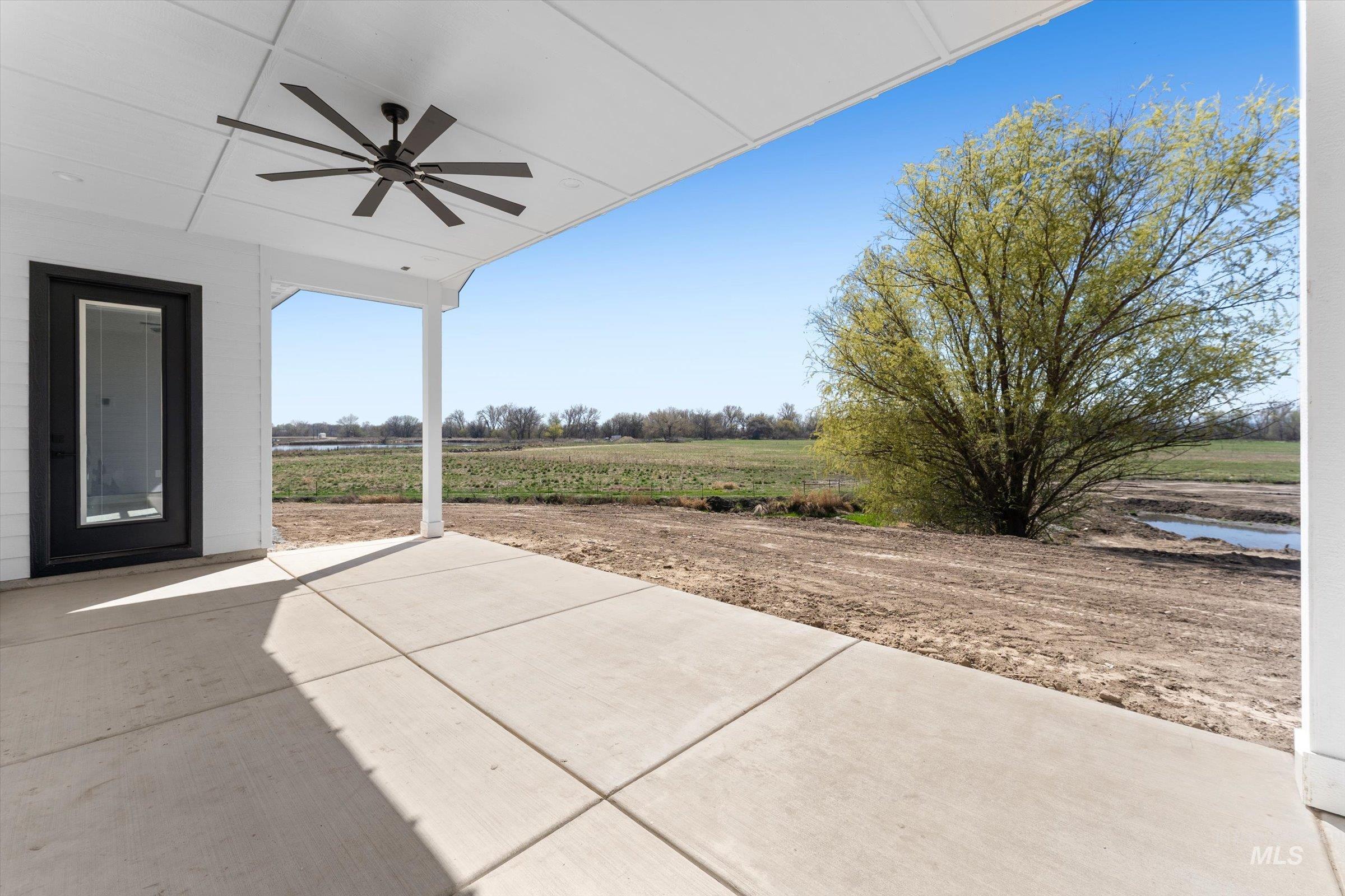 26219 Reed Lane Wilder, ID 83676 - Photo 20 of 35 View of patio with ceiling fan and a view of countryside