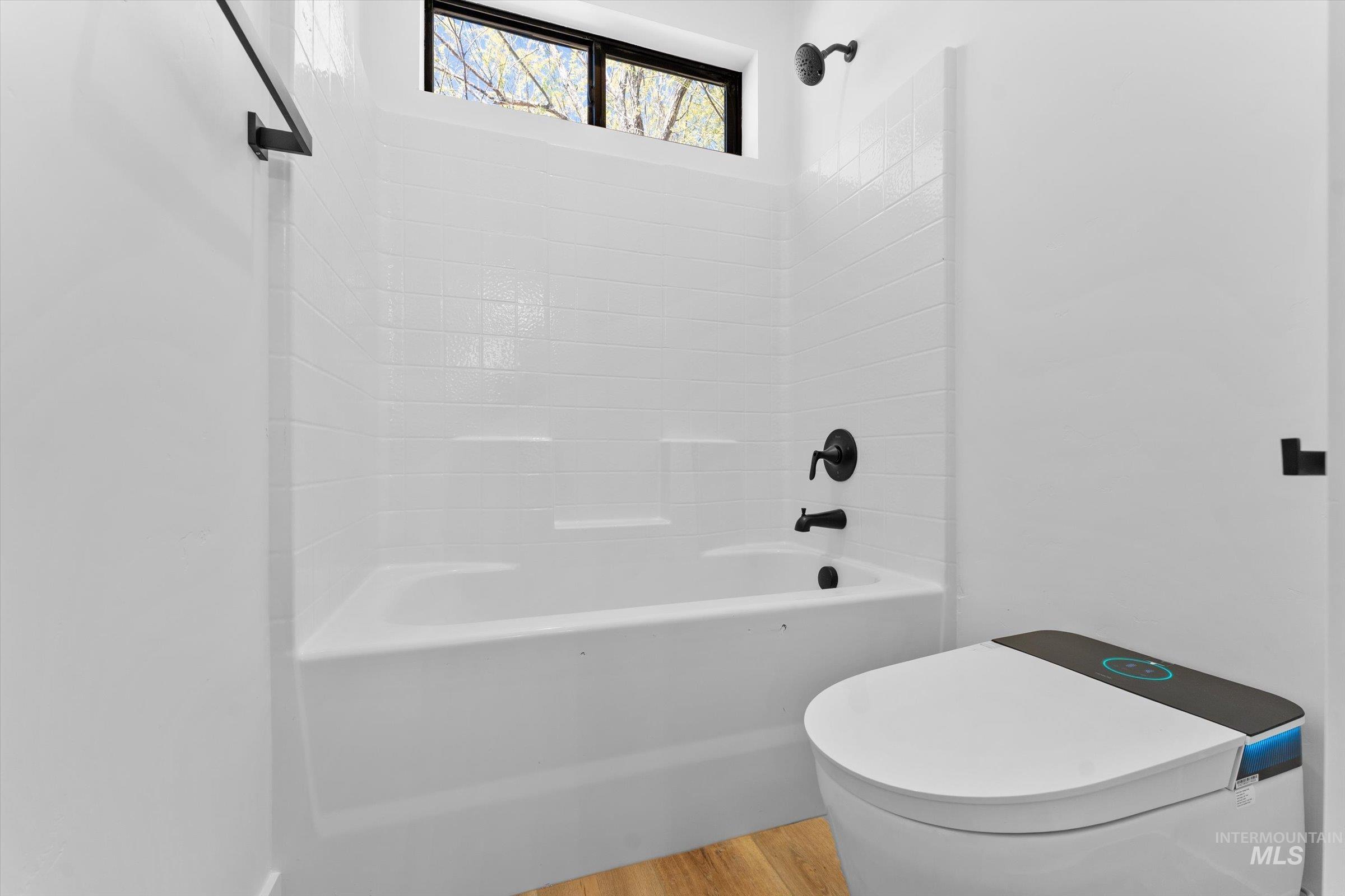 26219 Reed Lane Wilder, ID 83676 - Photo 23 of 35 Bathroom featuring light wood-style flooring and shower / bath combination