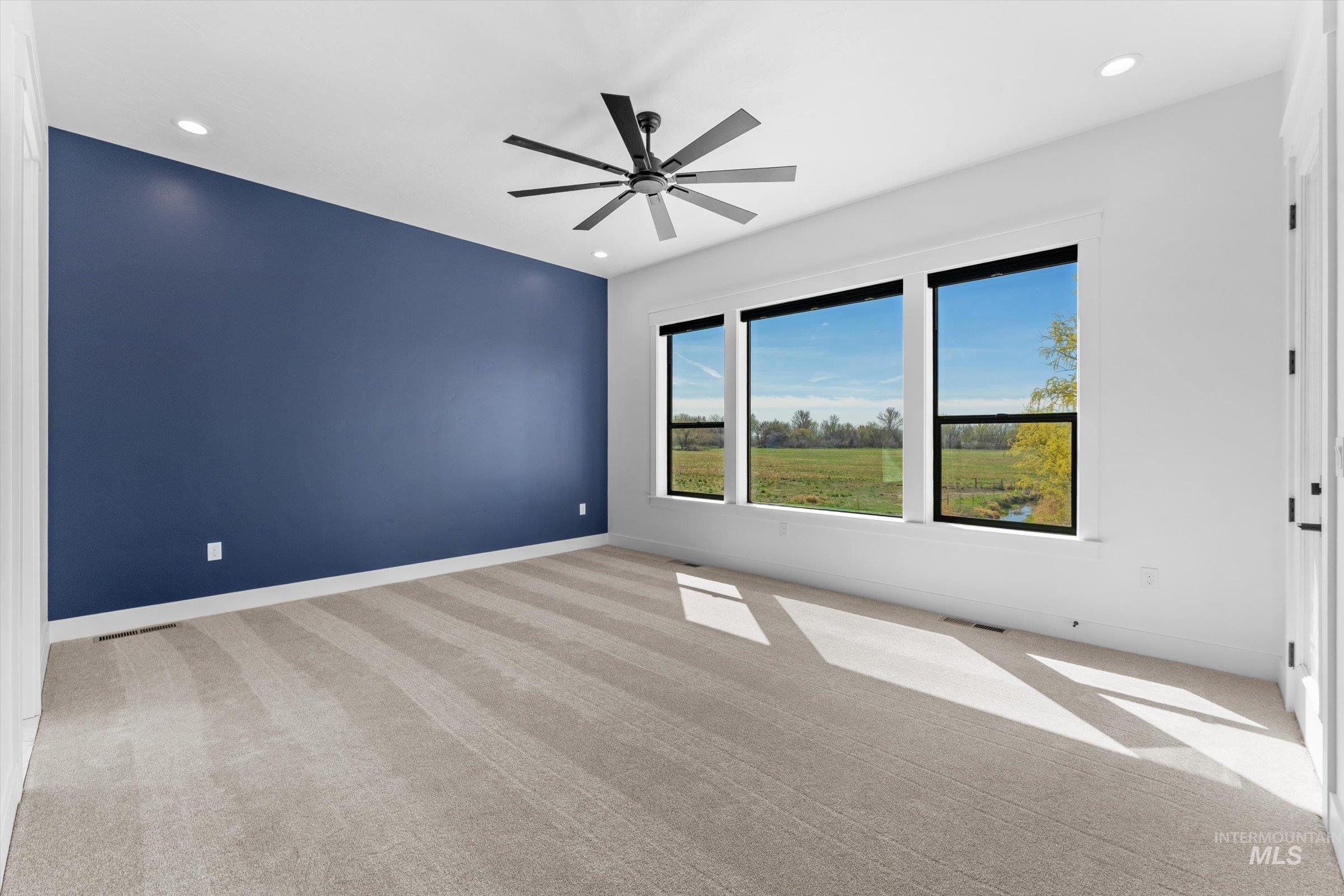 26219 Reed Lane Wilder, ID 83676 - Photo 26 of 35 Spare room featuring light colored carpet, recessed lighting, and ceiling fan