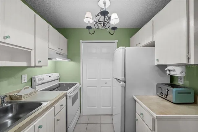 a view of storage and utility room with a sink and toys