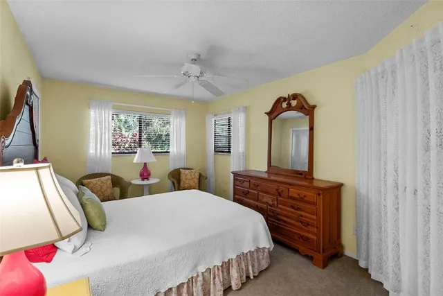 a bathroom with a sink toilet a mirror and shower