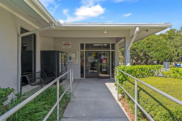 a view of a swimming pool with a yard