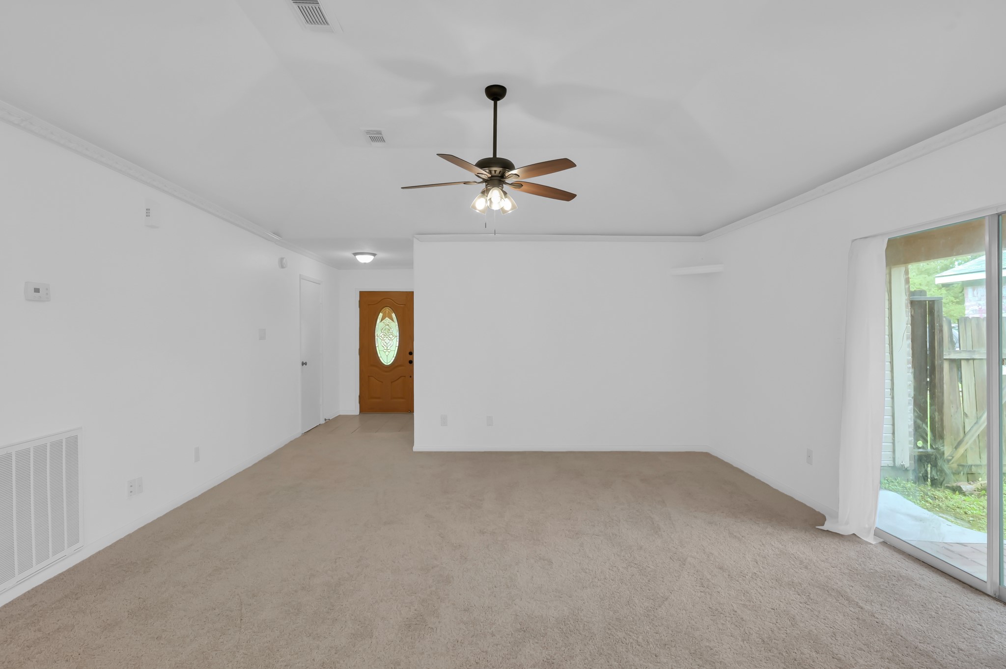 16937 Larkspur Conroe, TX 77385 - Photo 11 of 45 a view of an empty room with a window