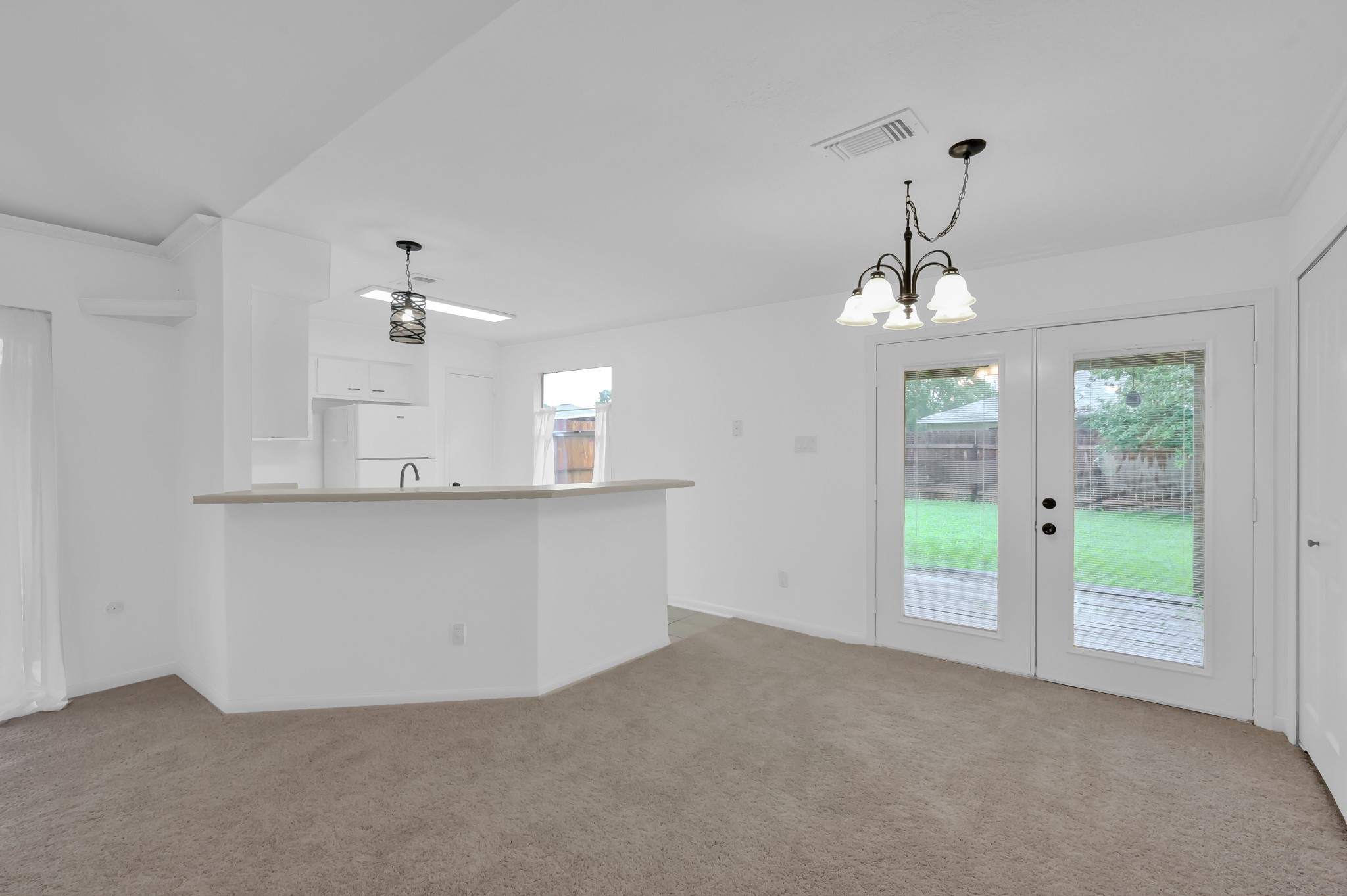 16937 Larkspur Conroe, TX 77385 - Photo 13 of 45 a view of an empty room with window and cabinet