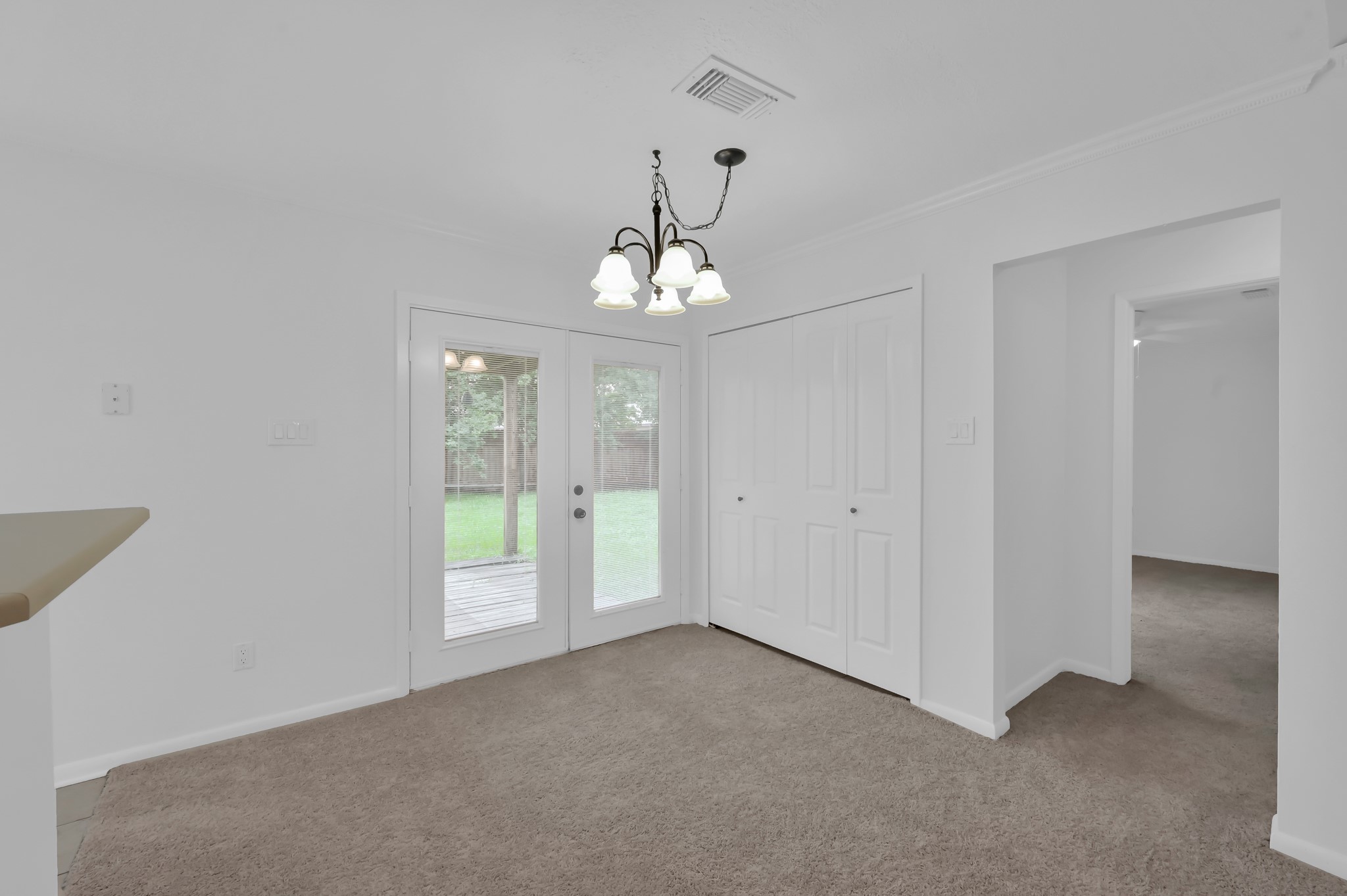 16937 Larkspur Conroe, TX 77385 - Photo 15 of 45 a view of a chandelier in big room and a bathroom