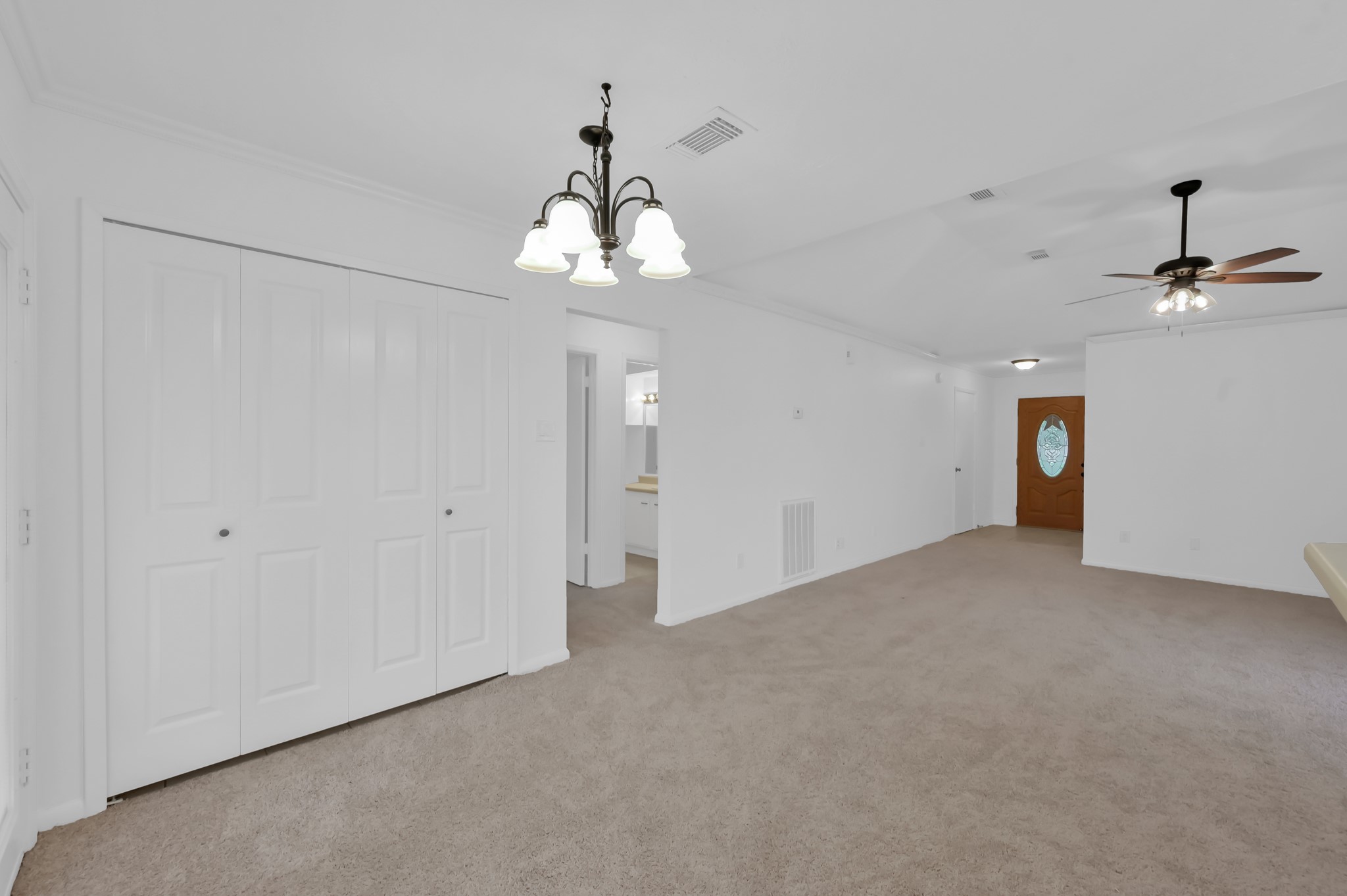 16937 Larkspur Conroe, TX 77385 - Photo 16 of 45 a view of a chandelier in big room and chandelier