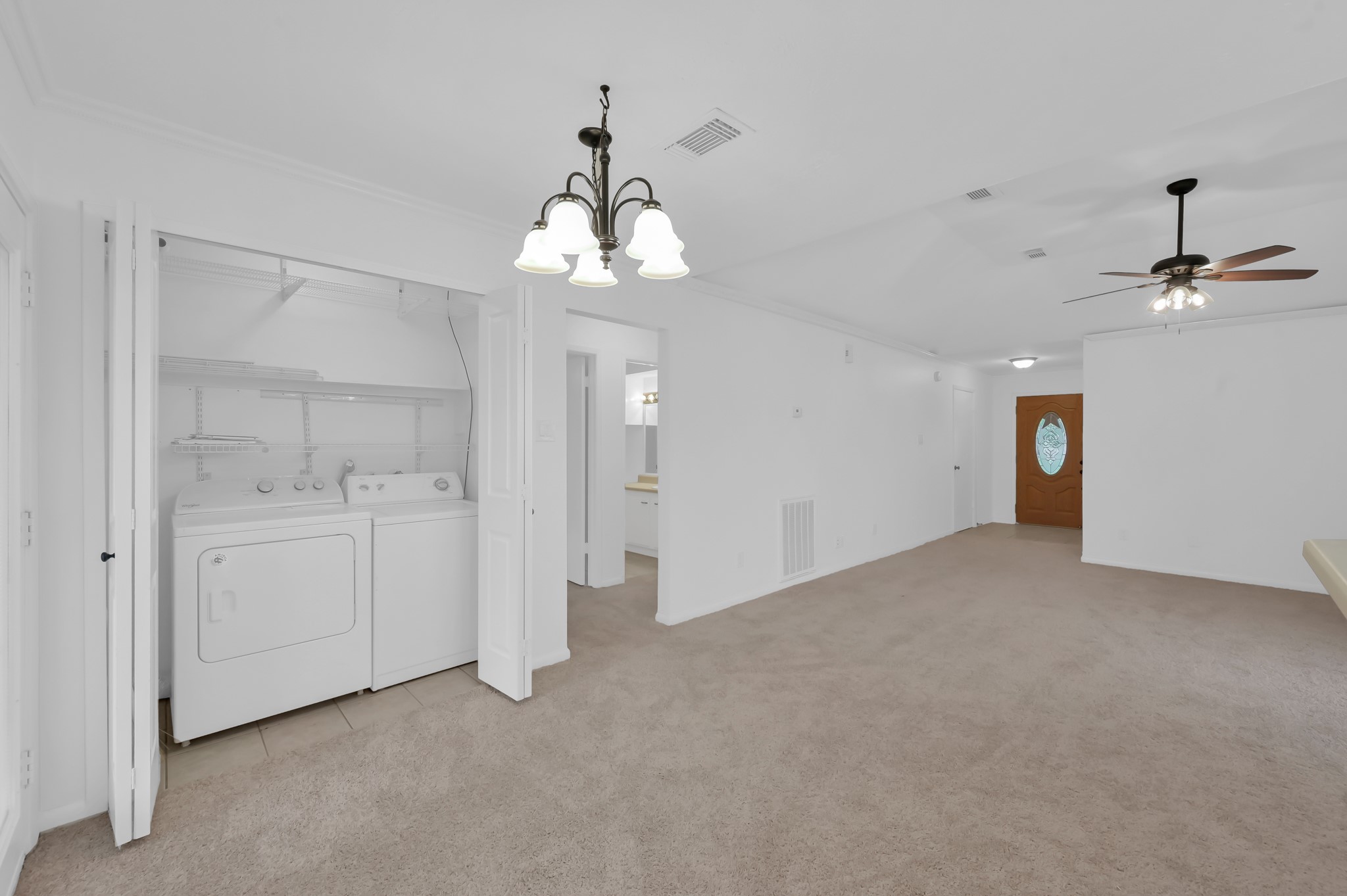 16937 Larkspur Conroe, TX 77385 - Photo 17 of 45 a view of a chandelier in a room