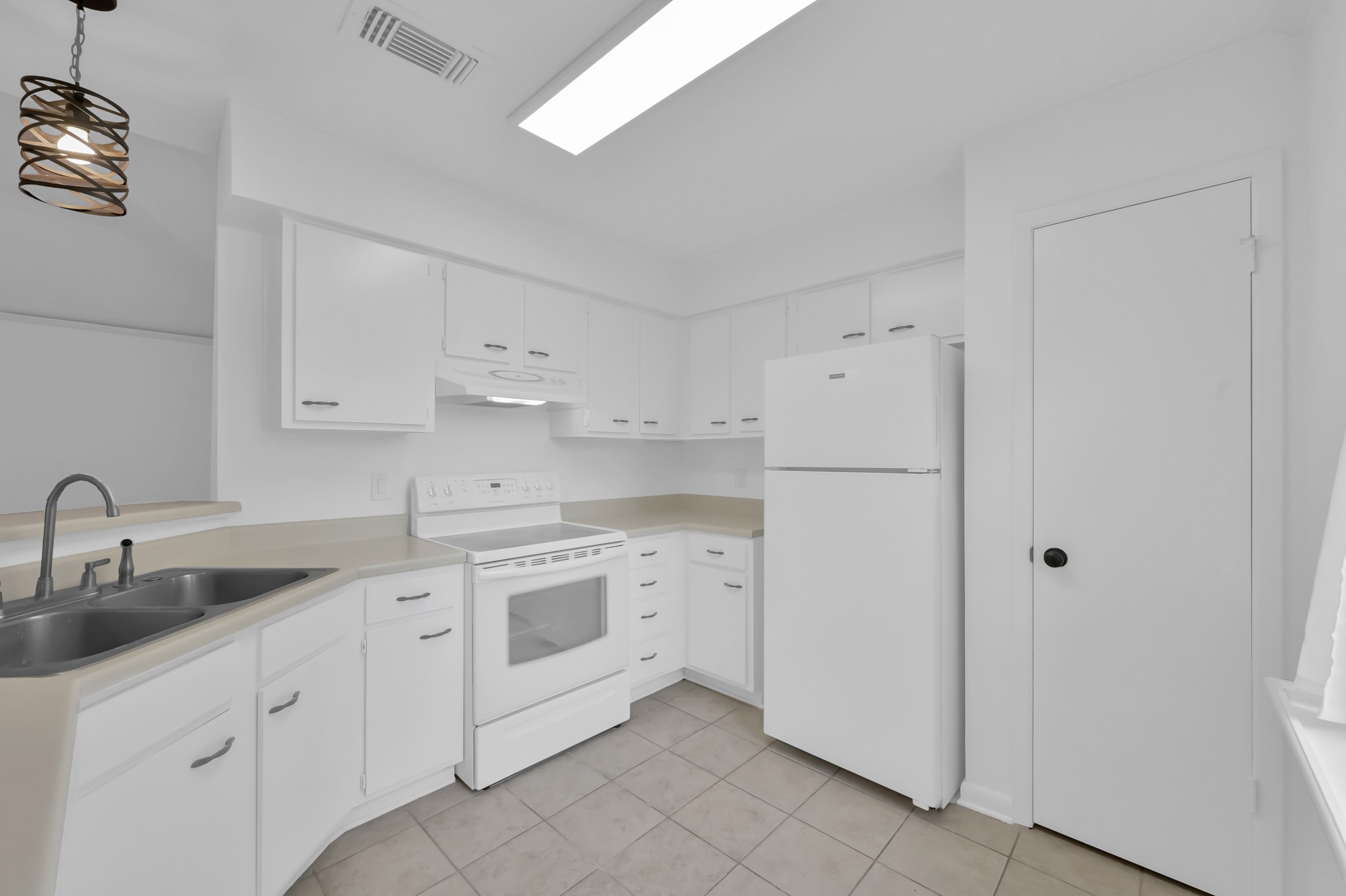 16937 Larkspur Conroe, TX 77385 - Photo 20 of 45 a kitchen with cabinets appliances and a sink