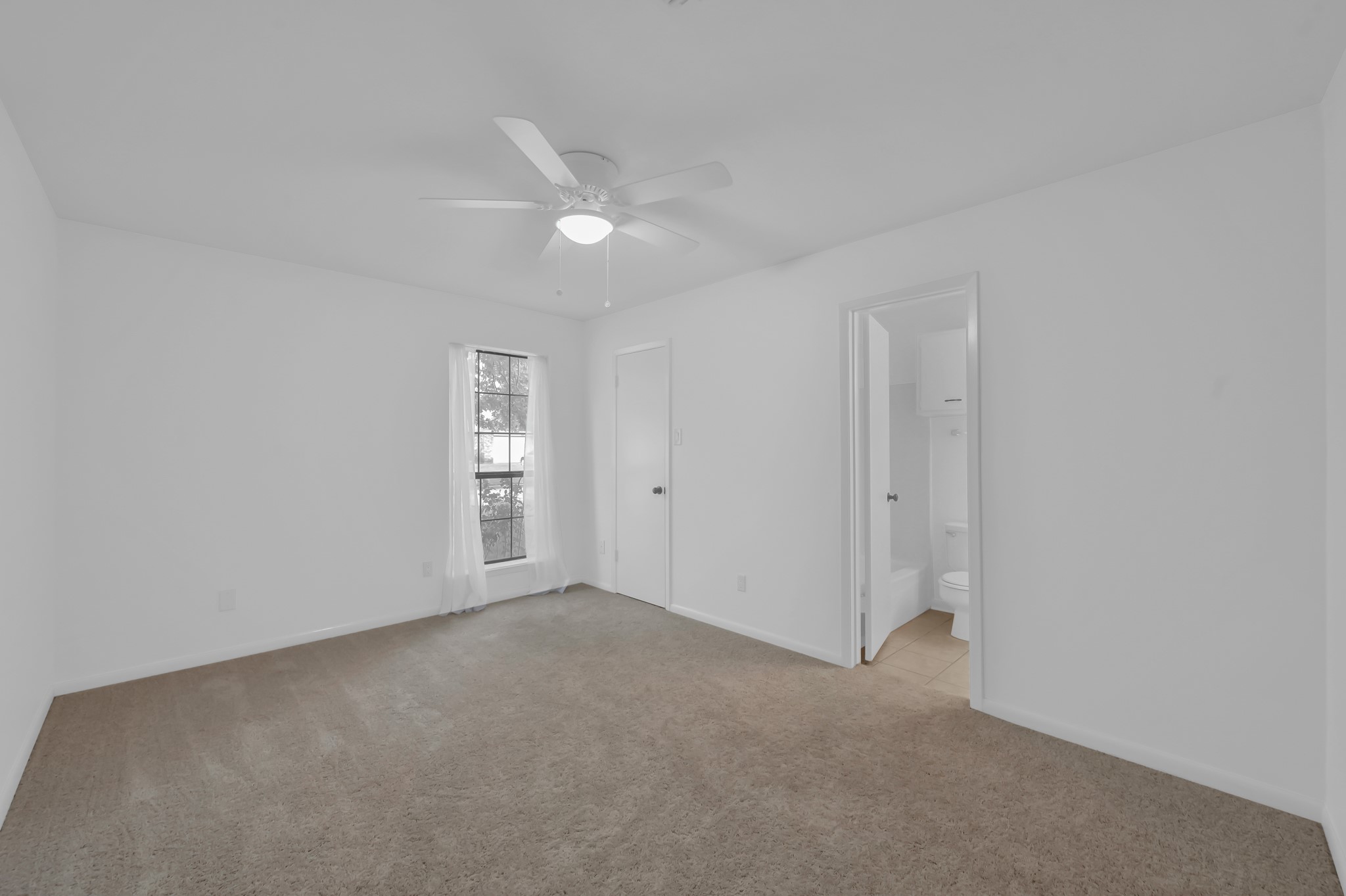 16937 Larkspur Conroe, TX 77385 - Photo 23 of 45 a view of an empty room with a window