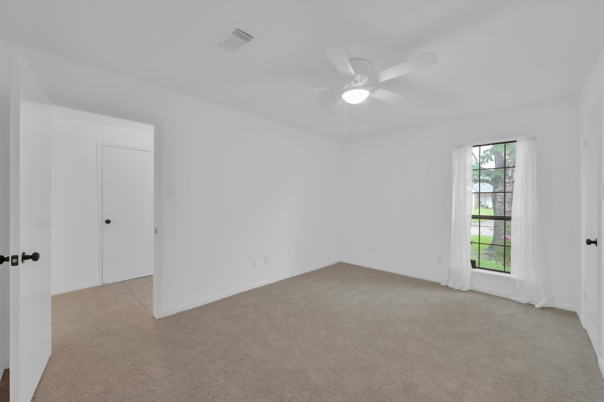 16937 Larkspur Conroe, TX 77385 - Photo 24 of 45 a view of an empty room with a window