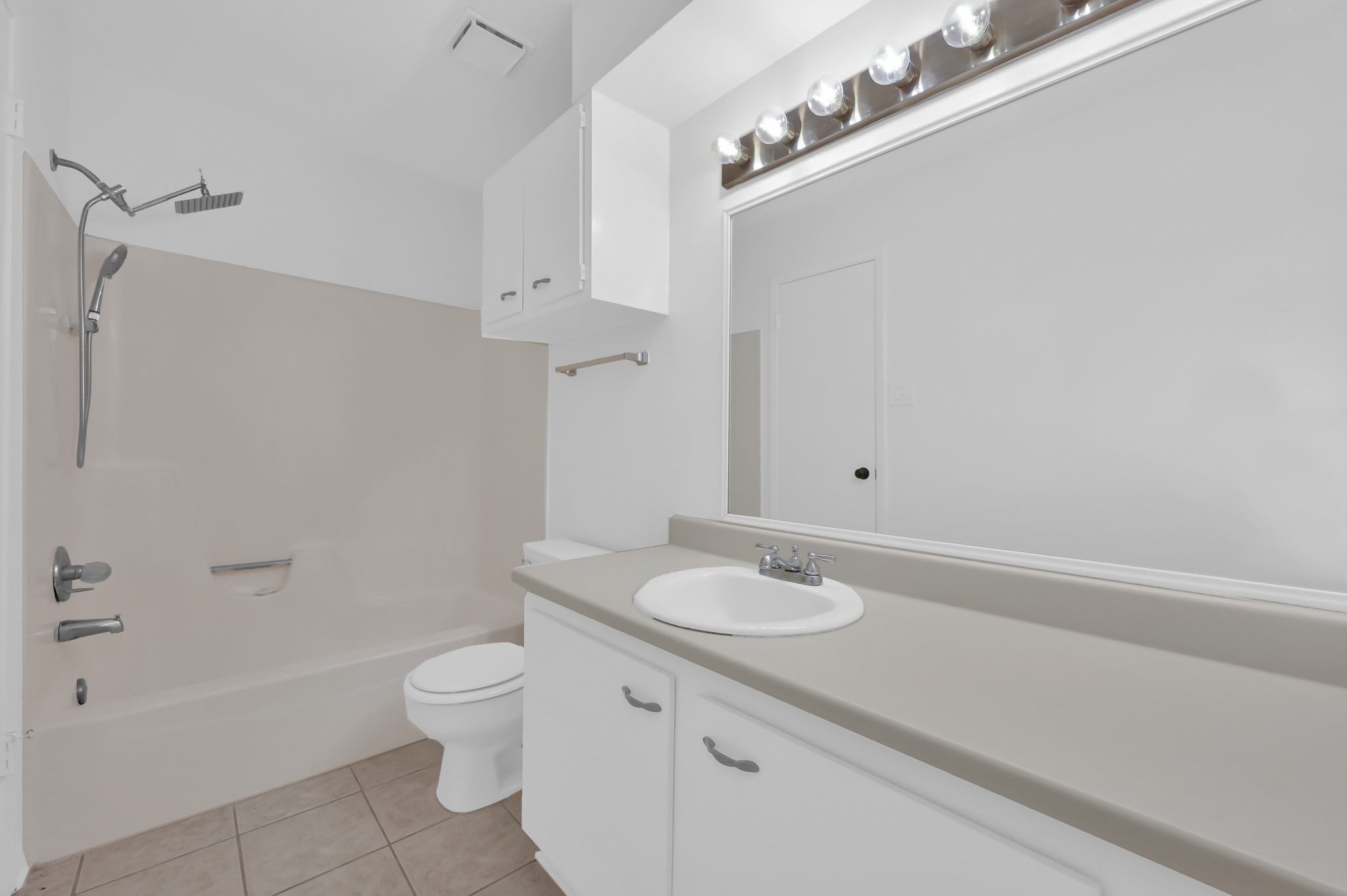 16937 Larkspur Conroe, TX 77385 - Photo 27 of 45 a bathroom with a sink a toilet and shower