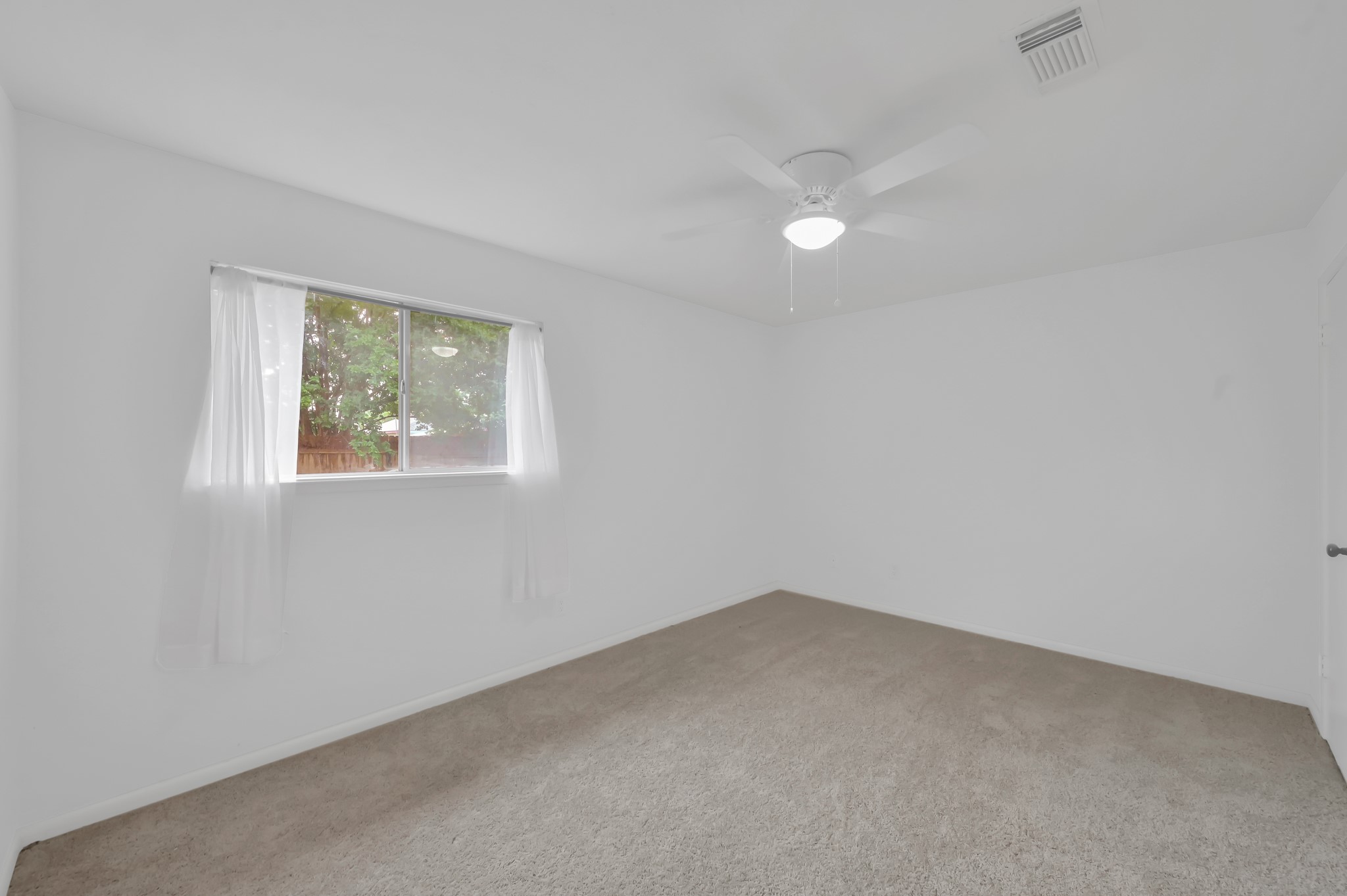 16937 Larkspur Conroe, TX 77385 - Photo 29 of 45 a view of an empty room with a window
