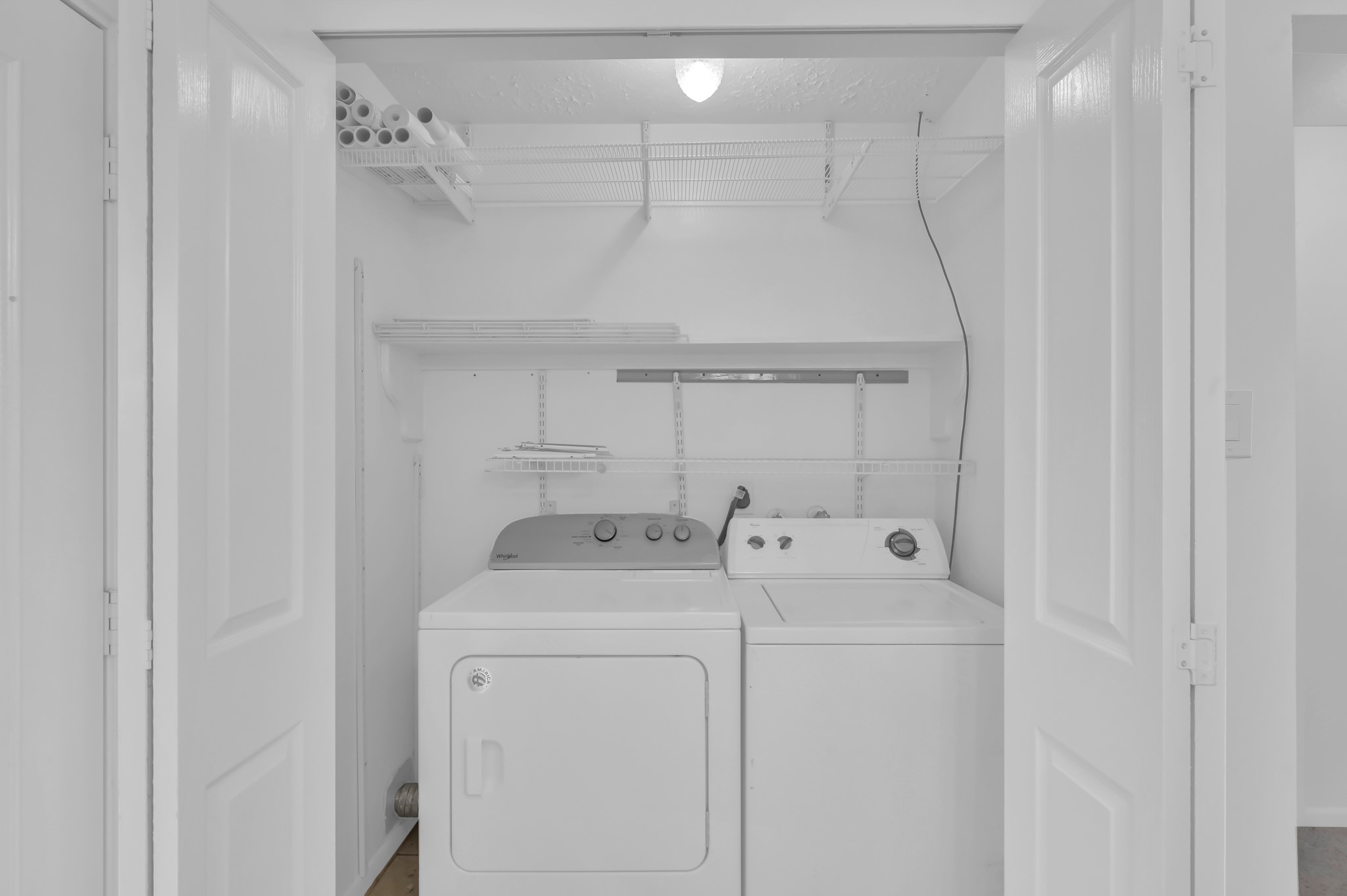 16937 Larkspur Conroe, TX 77385 - Photo 35 of 45 a utility room with dryer and washer