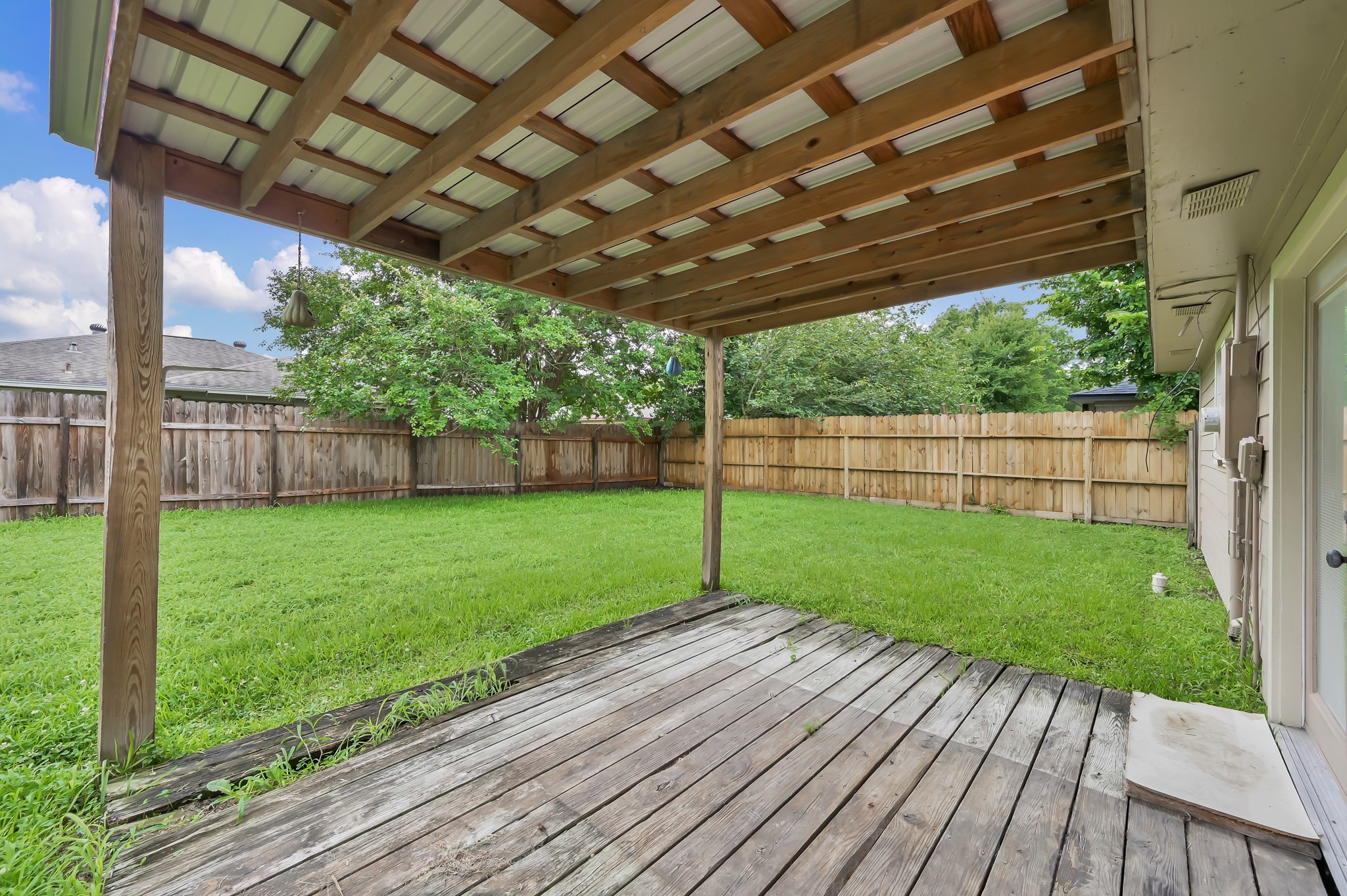16937 Larkspur Conroe, TX 77385 - Photo 36 of 45 a view of a backyard with wooden floor