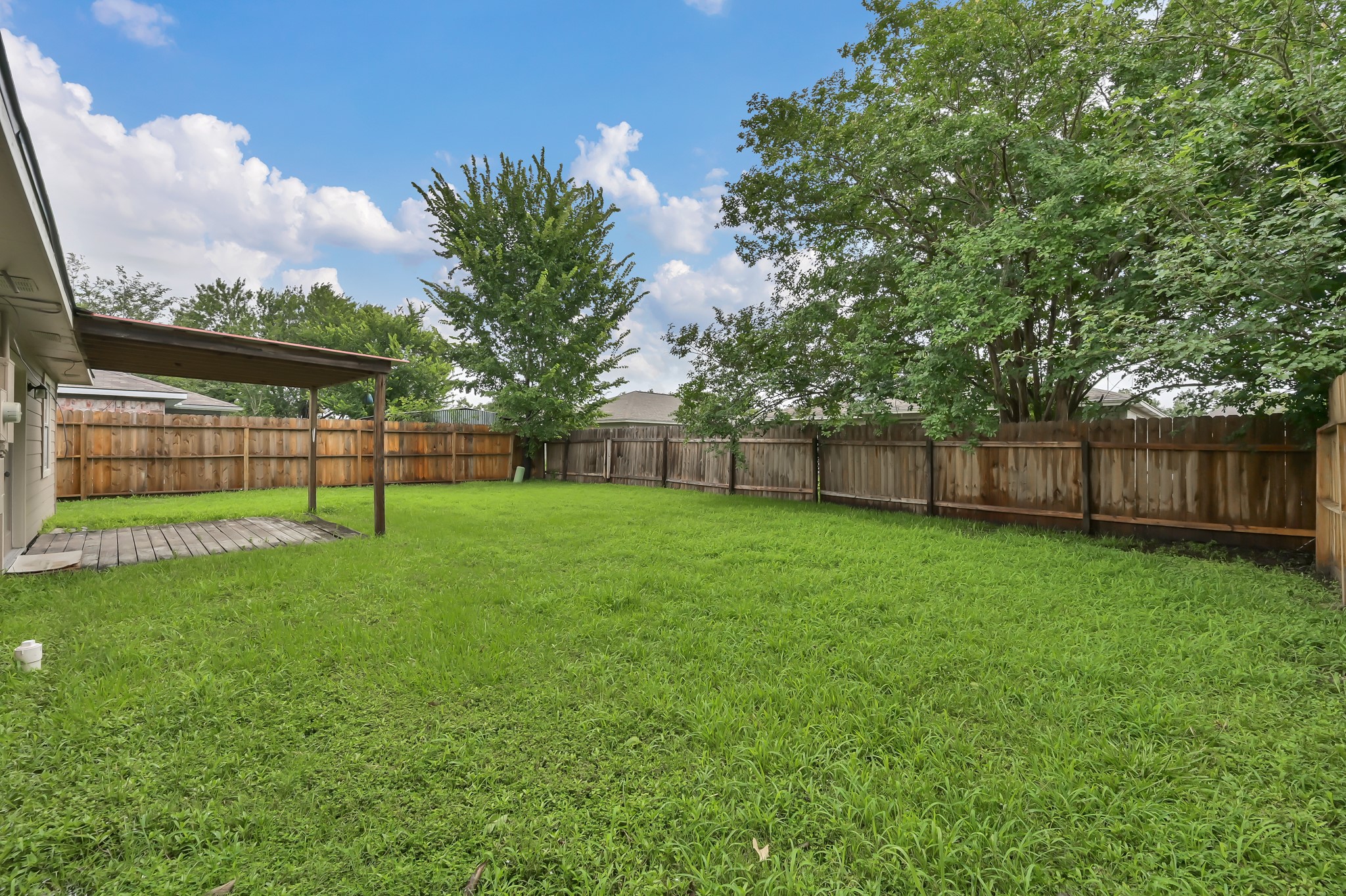 16937 Larkspur Conroe, TX 77385 - Photo 38 of 45 a view of a yard with a slide